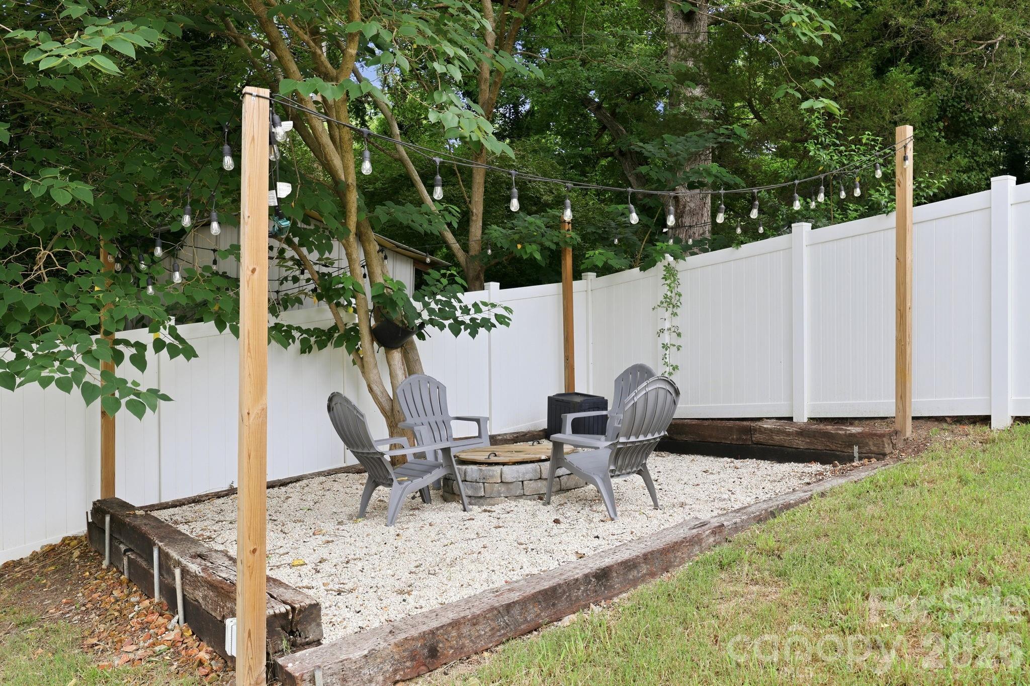 Enjoy gatherings around the firepit in the private rear yard - 527 S 2nd Street, Albemarle
