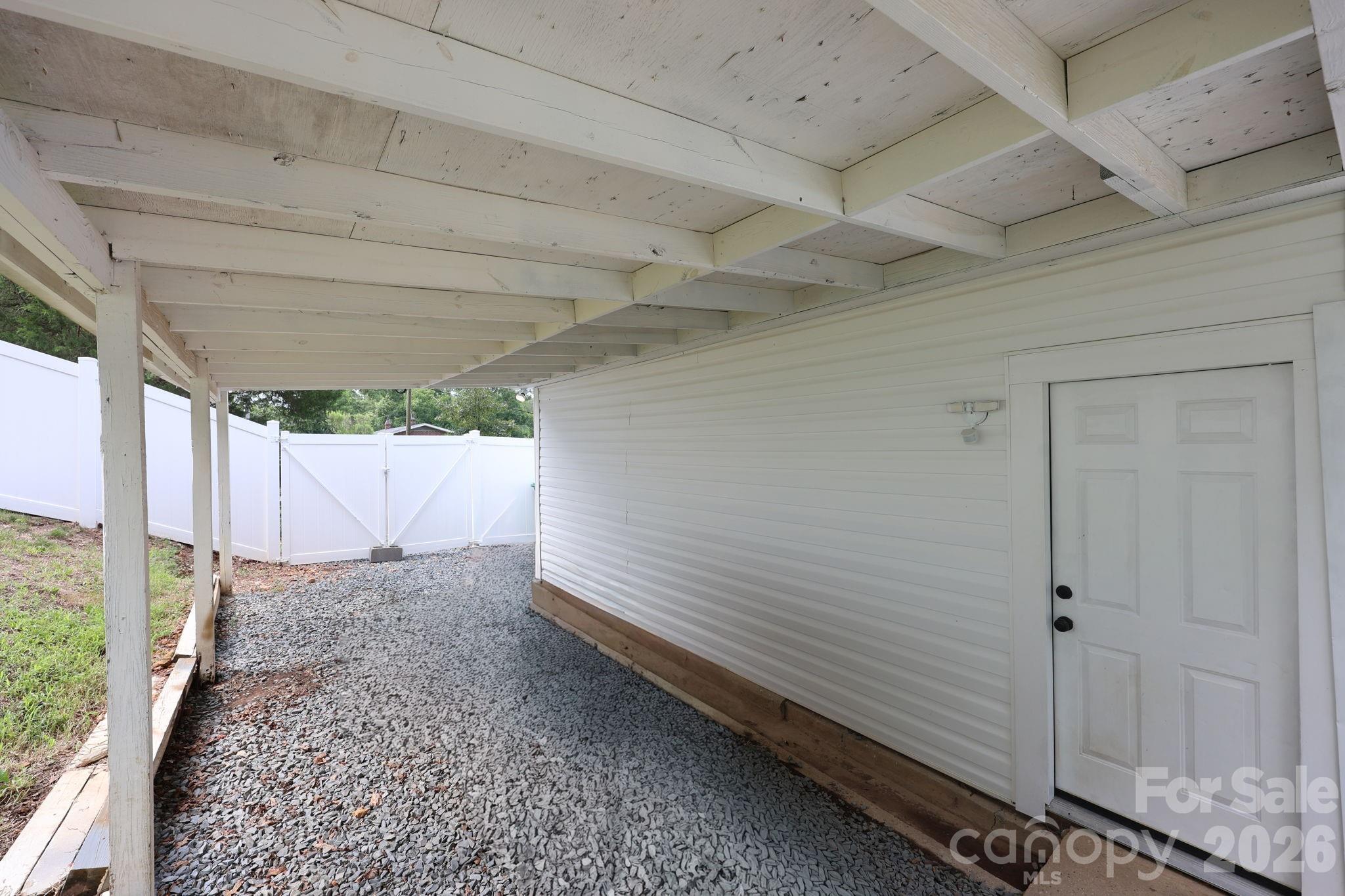 Pull your car under the carport in the gated back yard - 527 S 2nd Street, Albemarle