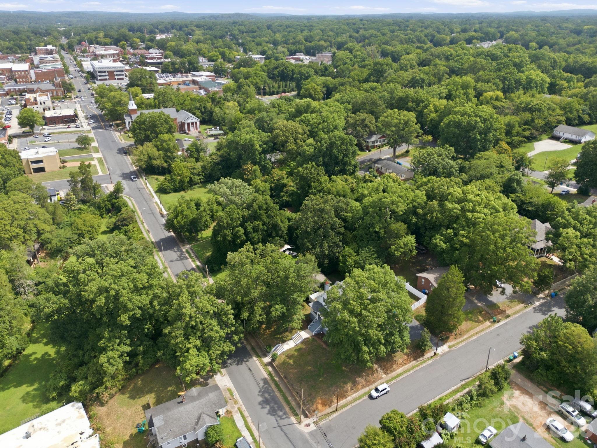 Situated on a corner lot with mature trees providing shade on the hot summer days - 527 S 2nd Street, Albemarle