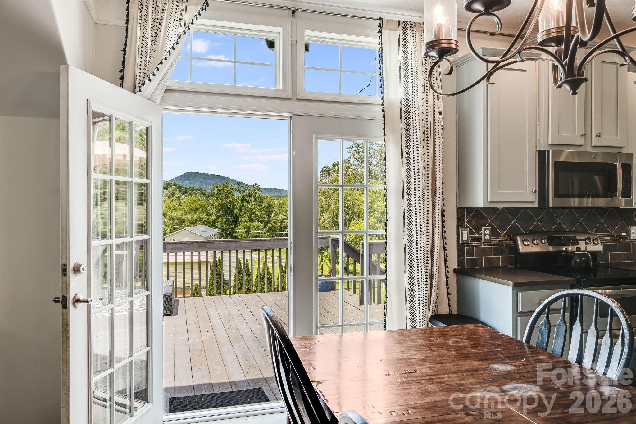 Sit a spell on the private back porch with mountain views. - 21 Old Pinner Place, Arden