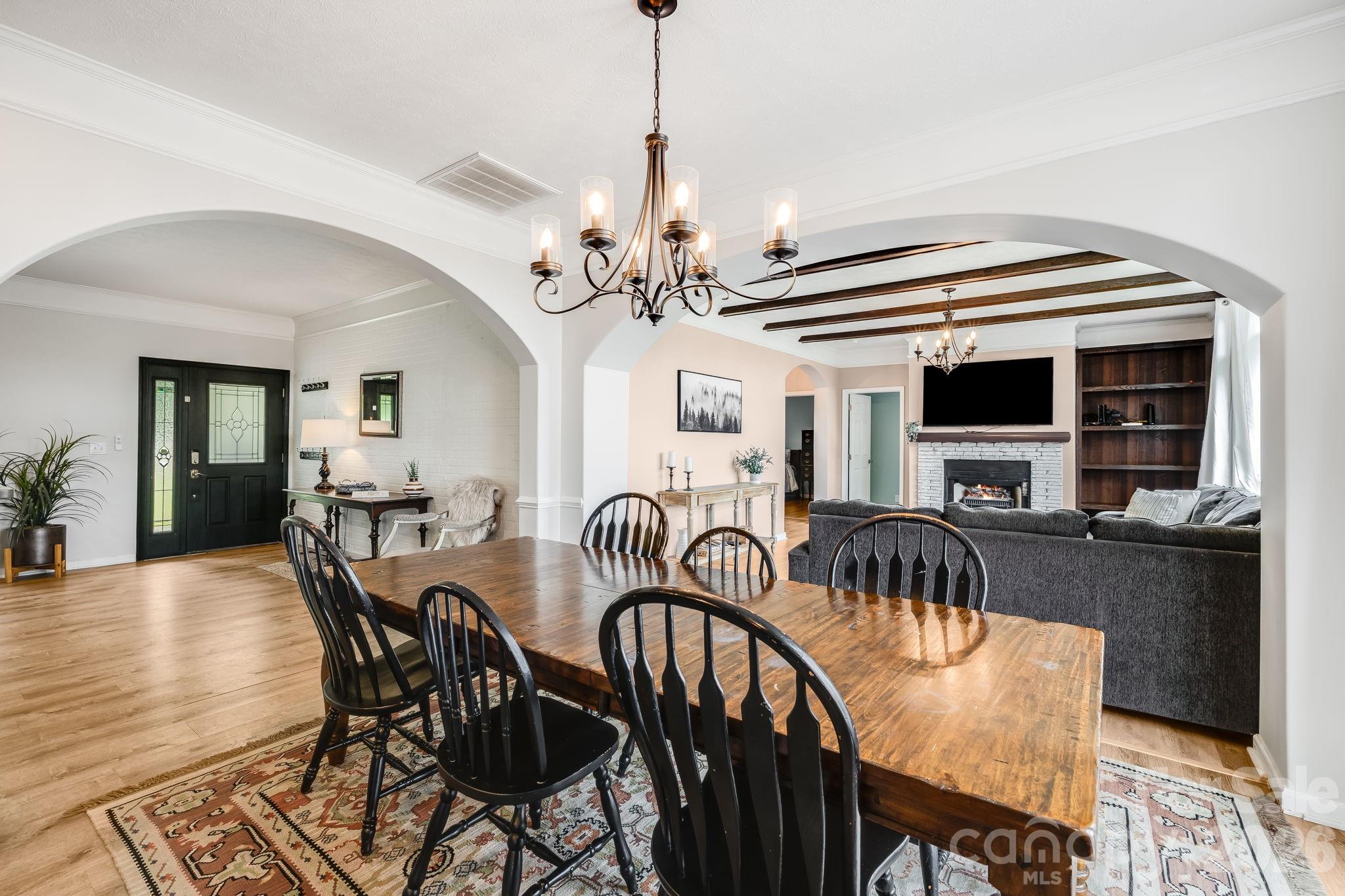 Open concept floor plan. Kitchen/dining opens to game room on one side and living room on the other - 21 Old Pinner Place, Arden