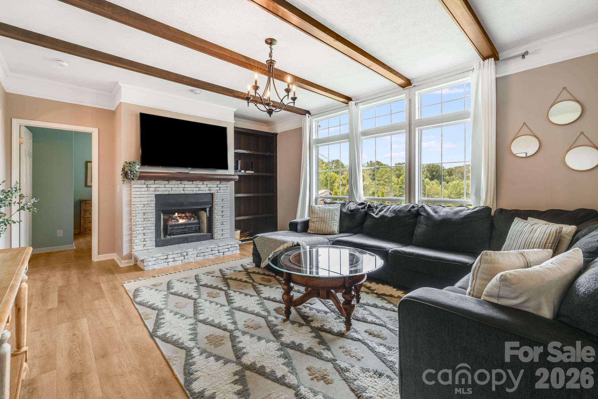 Living room with gas fireplace. Cozy nights inside this fall and winter! - 21 Old Pinner Place, Arden