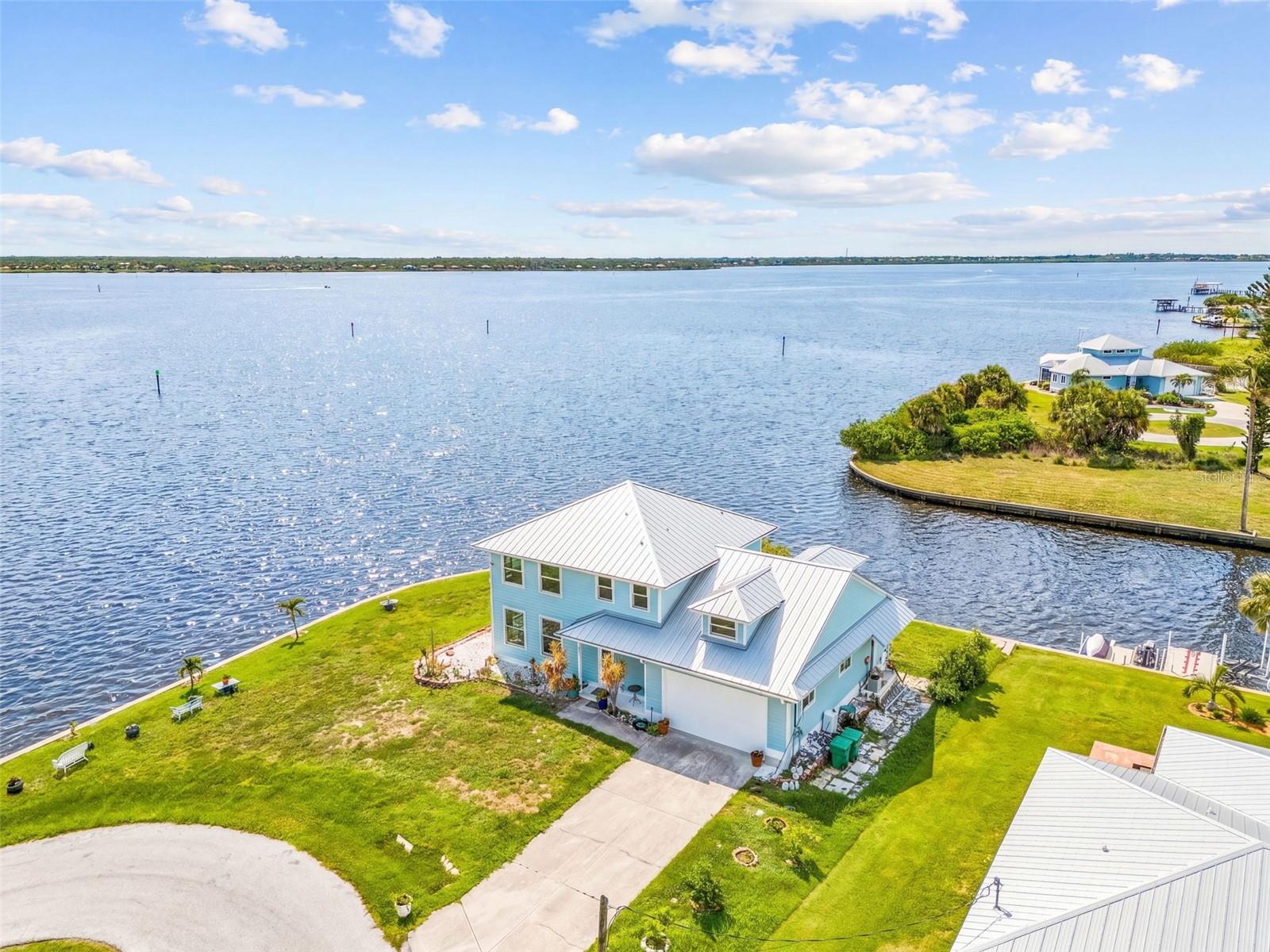 Aerial view of the home with the canal and river behind the property. - 2380 VANCE TER, PORT CHARLOTTE