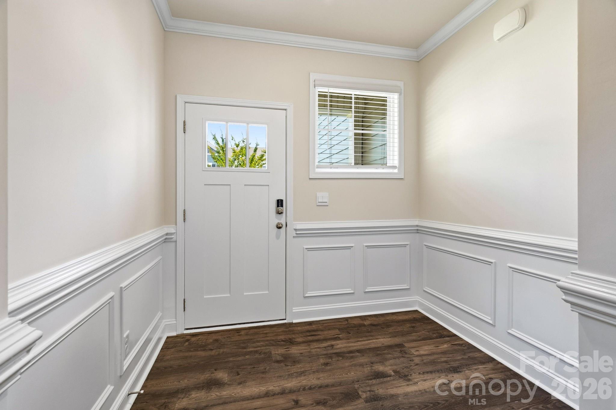 Welcoming entry with custom wainscoting. - 4103 Steel Way, Sherrills Ford