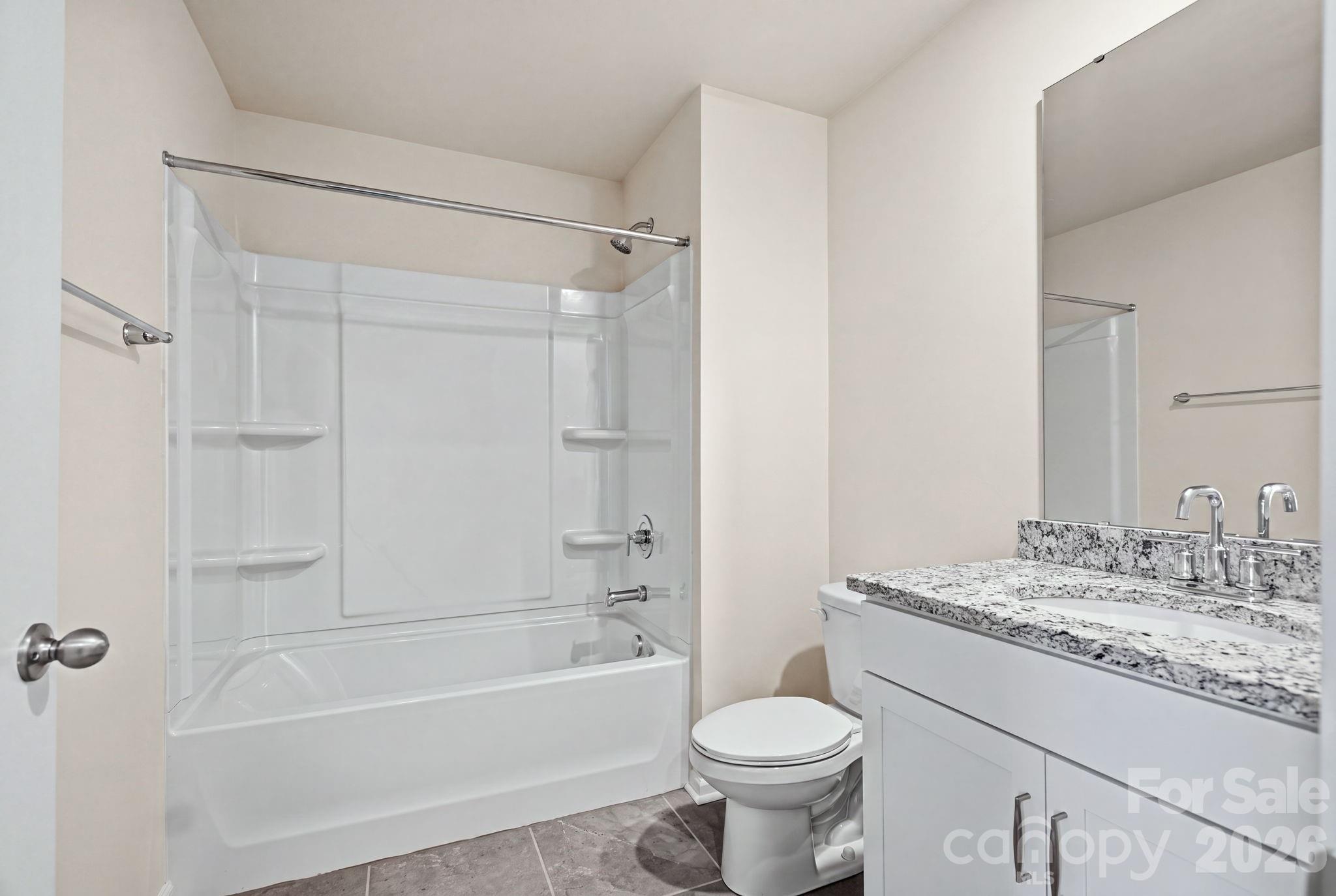 Modern full bath serving the secondary bedrooms. - 4103 Steel Way, Sherrills Ford