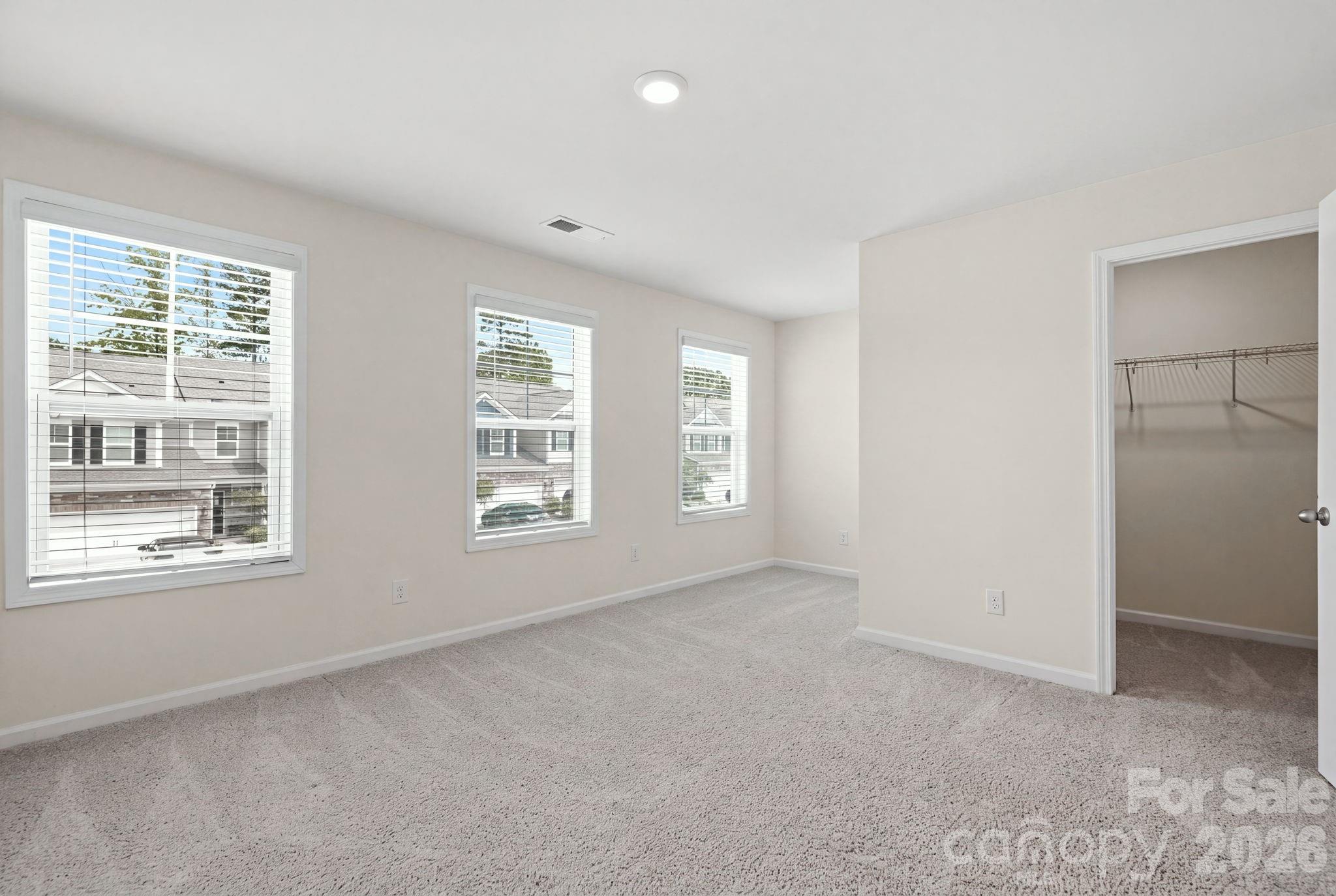 Spacious third bedroom with a walk-in closet. - 4103 Steel Way, Sherrills Ford