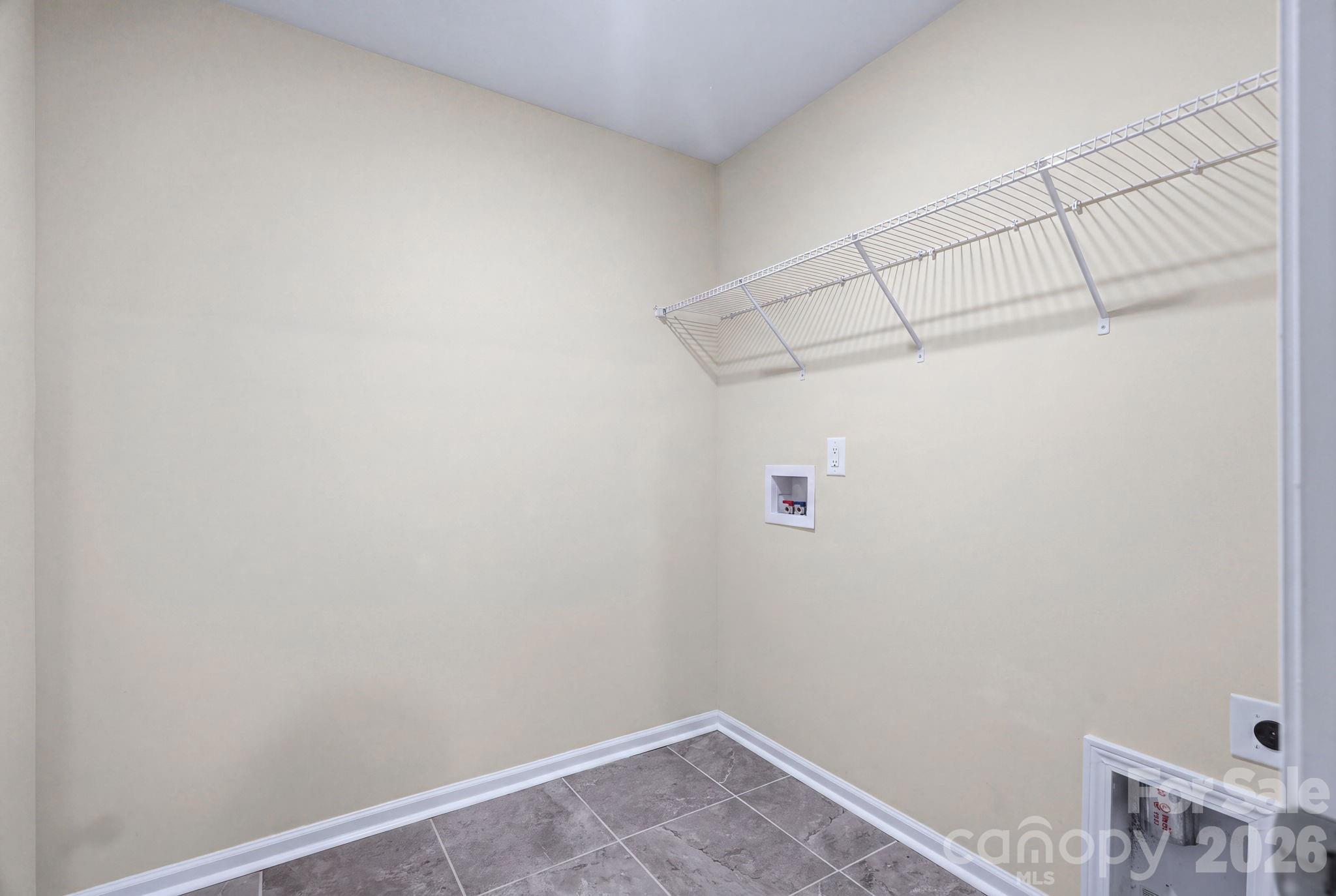 Upstairs laundry room designed for everyday convenience. - 4103 Steel Way, Sherrills Ford