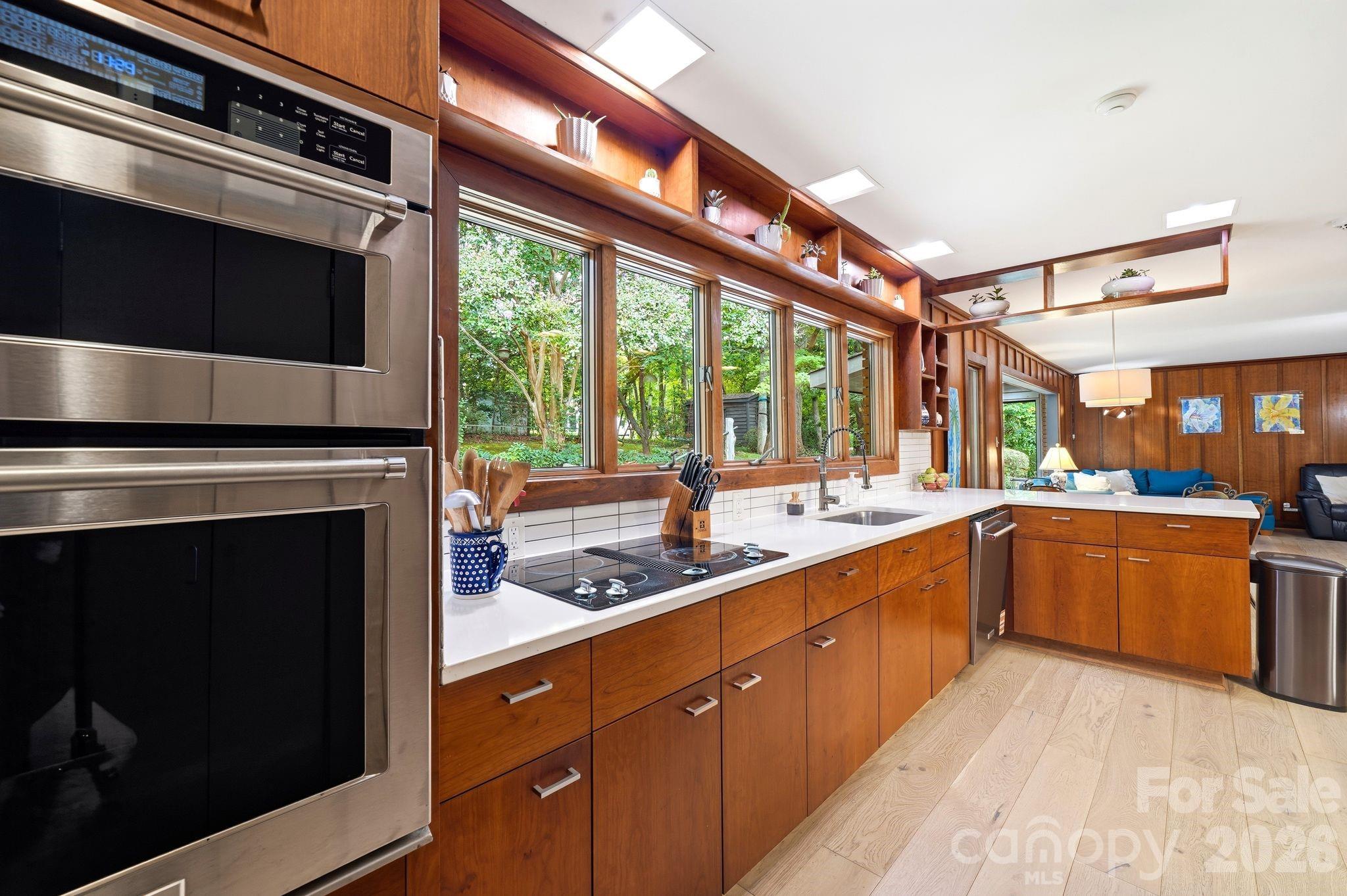 Stainless Steel Appliances and quartz countertops blend seamlessly with the MDM aesthetic. - 515 Dogwood Lane, Belmont