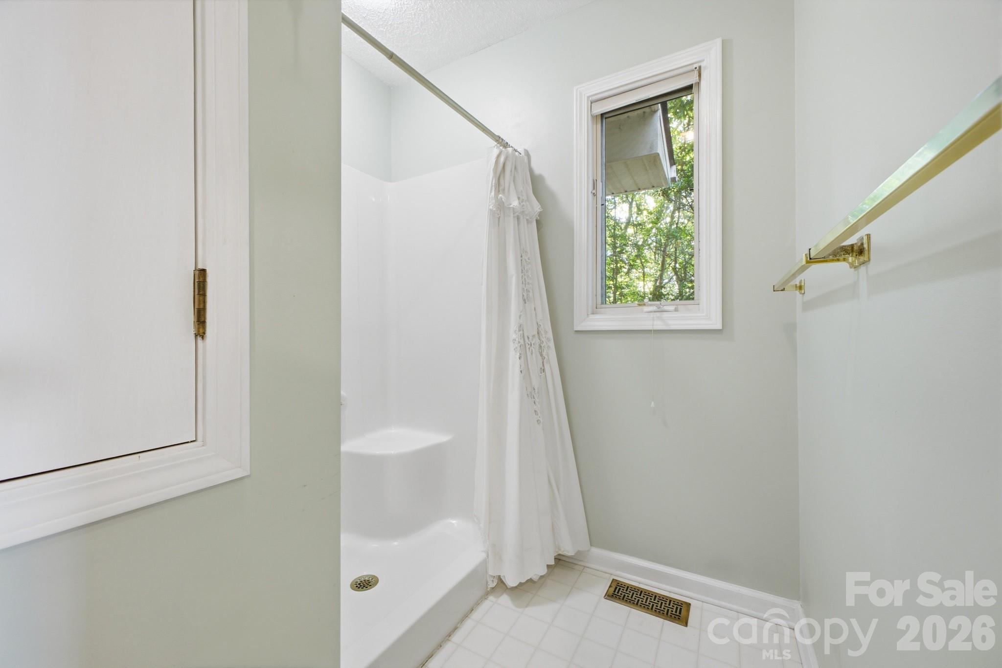 Primary Bath has a Walk In Shower - 1870 Riverview Court, Hendersonville