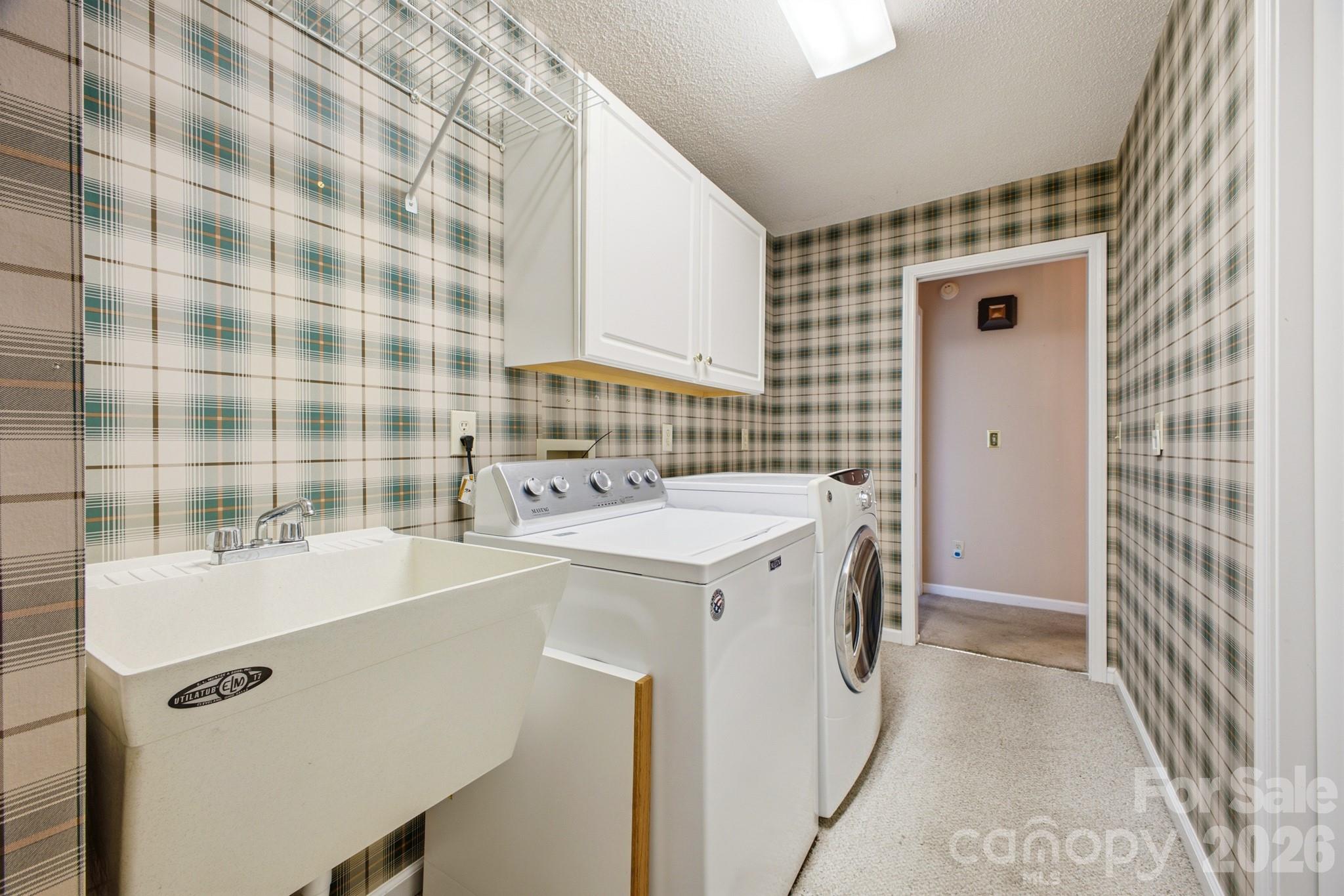 Laundry Room has a sink, 2 pantries (not in photo) & room for a freezer - 1870 Riverview Court, Hendersonville