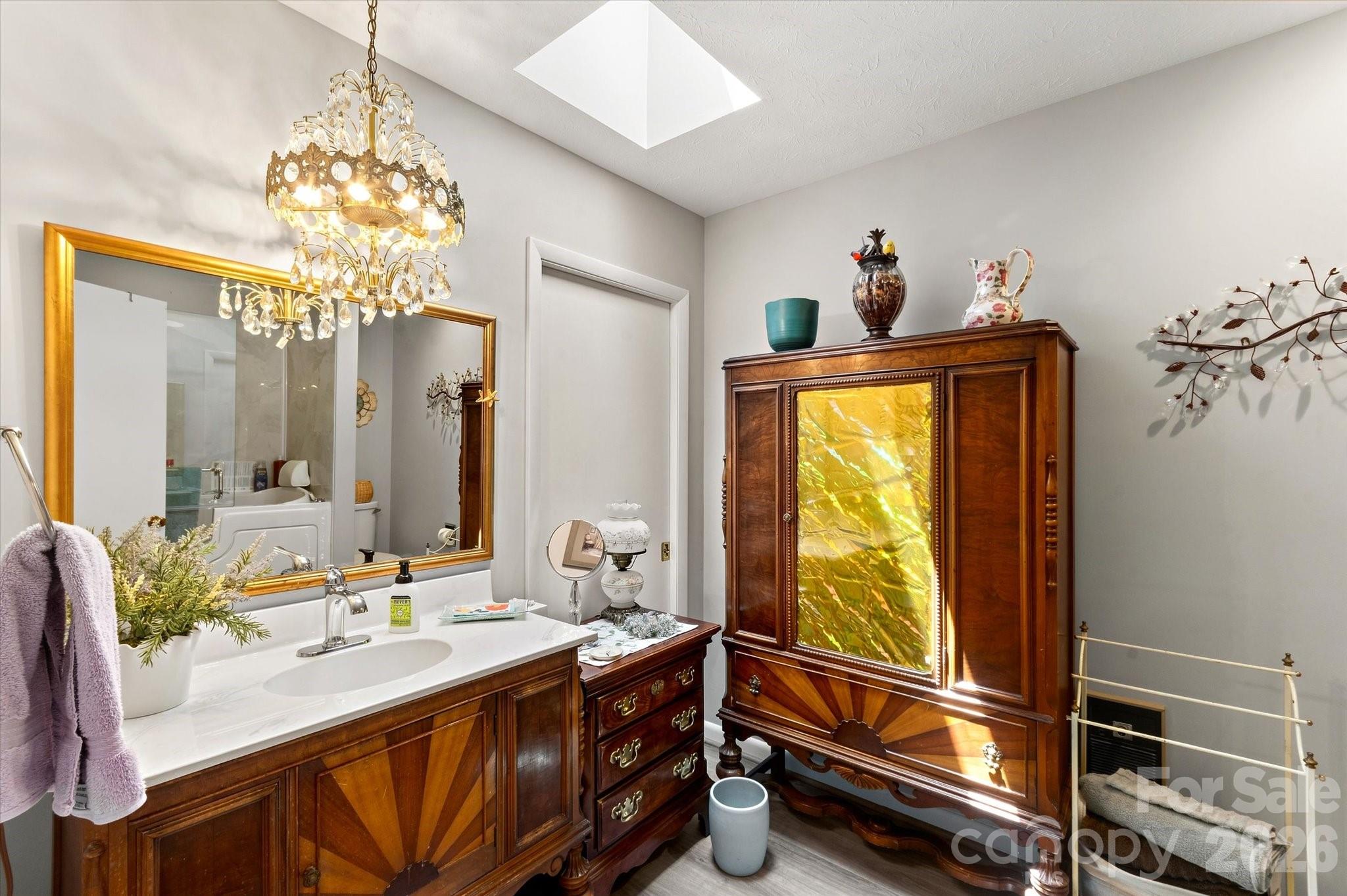 guest bath on main level with new counter top - 12 Highlander Lane, Hendersonville