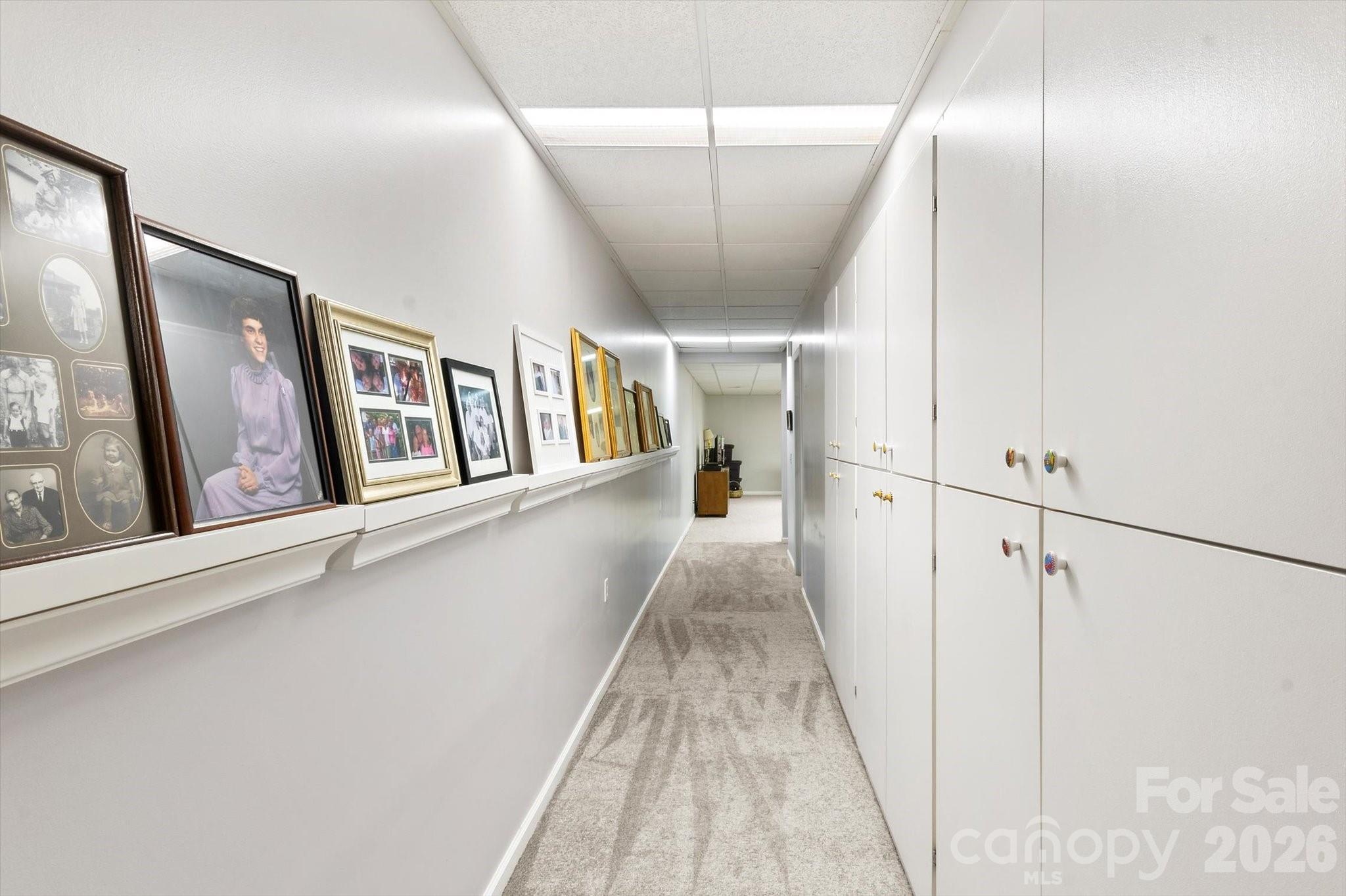 lower level hallway with tons of starage - 12 Highlander Lane, Hendersonville