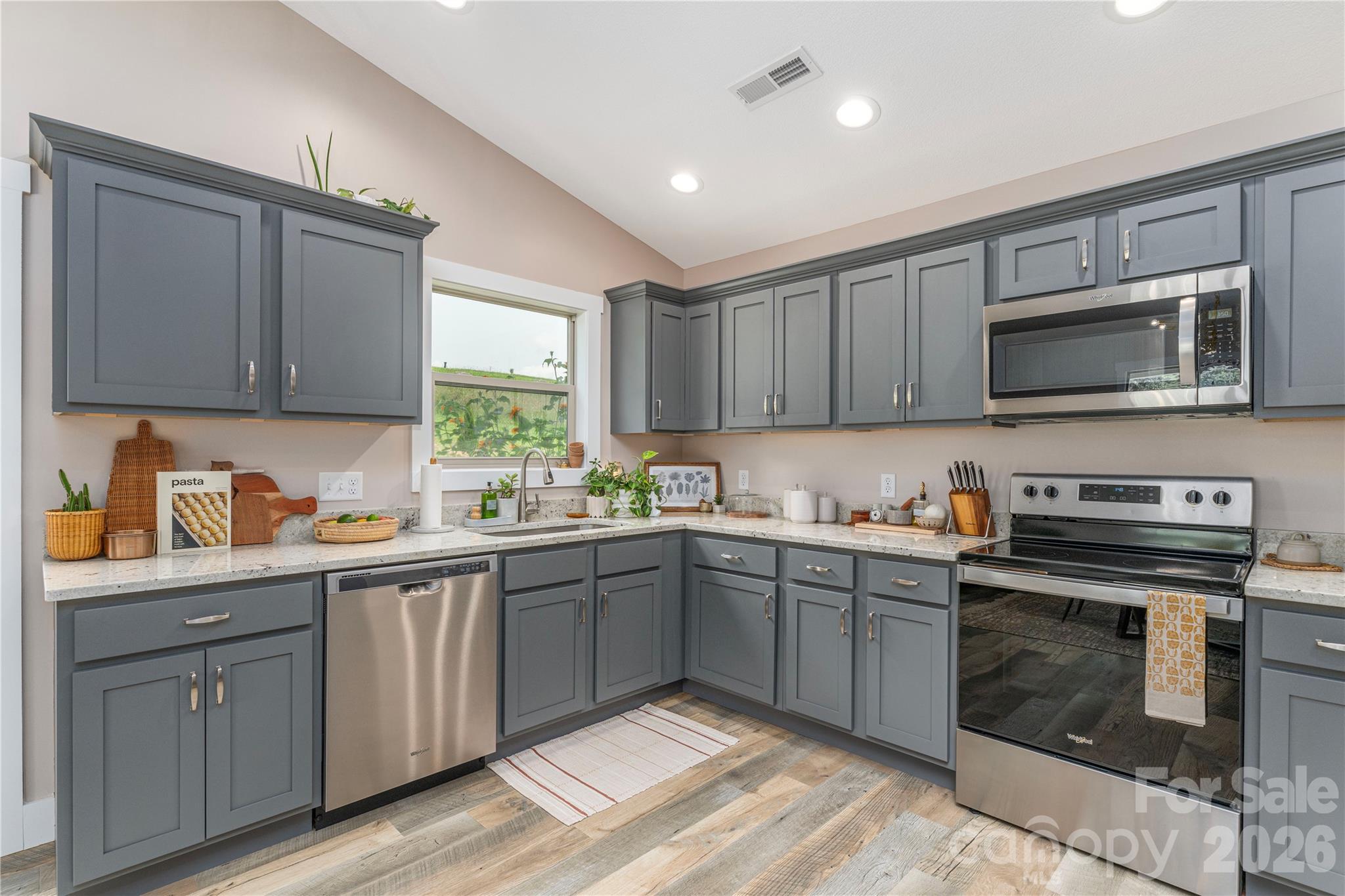 Neutral cedar shake cabinets with brushed nickel hardware - 38 Sunrise Drive, Mars Hill