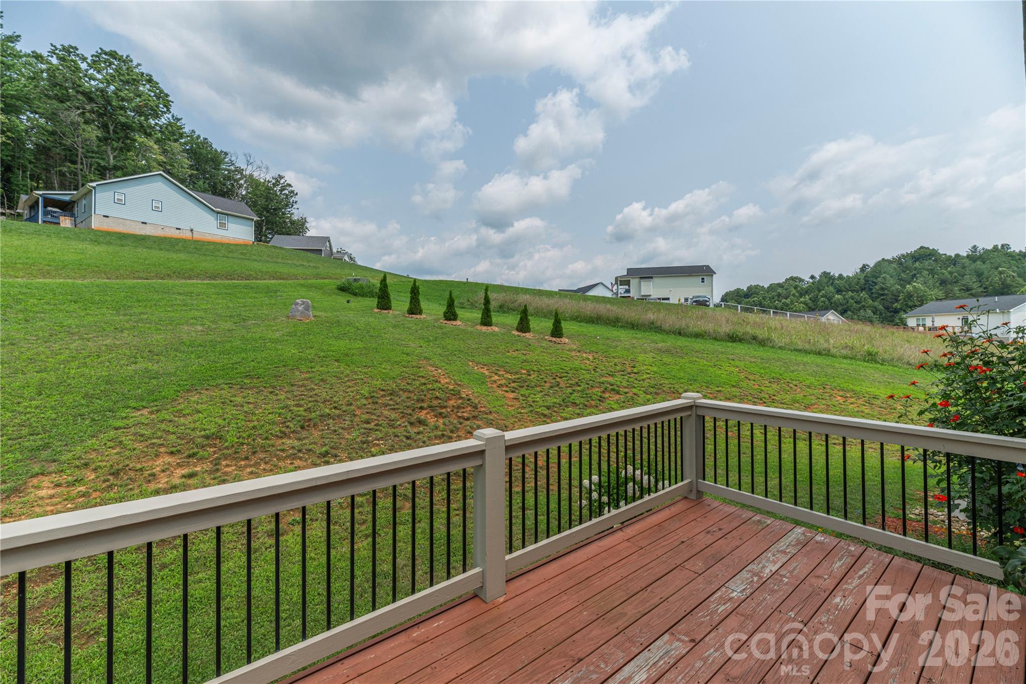 Spacious grounds provide plenty of sun and room for gardening, enjoying nature, and outdoor recreation - 38 Sunrise Drive, Mars Hill