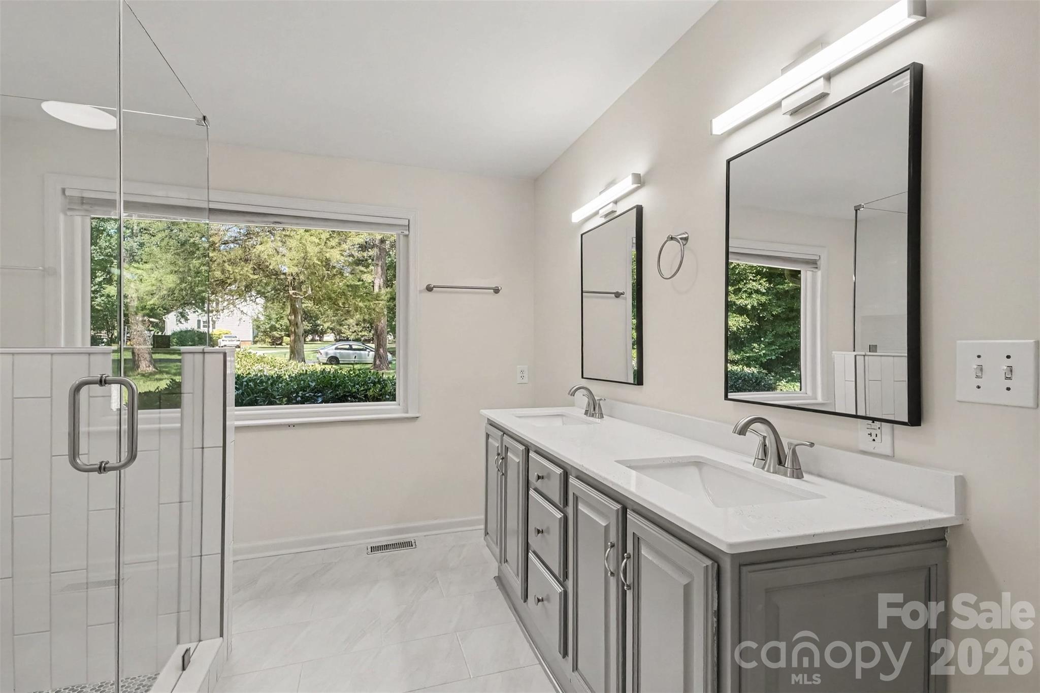 And getting ready in the morning a JOY in your renovated new owners' bathroom -- dual vanity, water closet, space for makeup table and large walk-in closet. - 13520 Andulusian Drive, Matthews