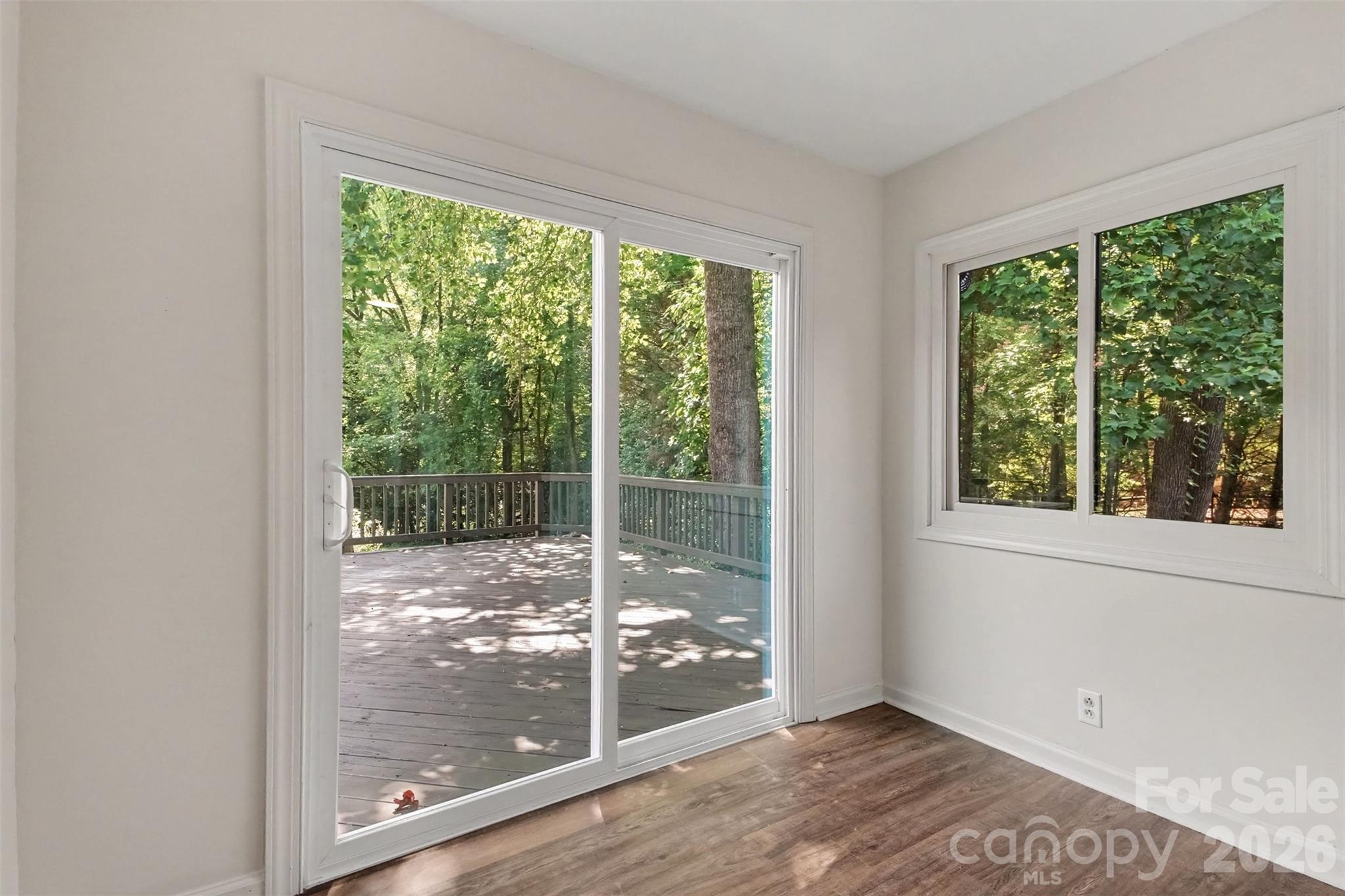On rainy days, you'll love your cute sunroom that overlooks your private backyard. - 13520 Andulusian Drive, Matthews