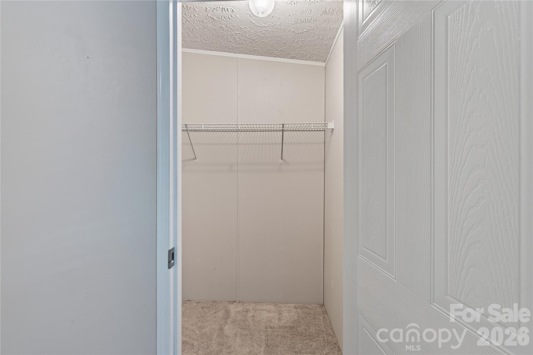 Walk in closet in primary bedroom - 146 Banks View Lane, Hendersonville