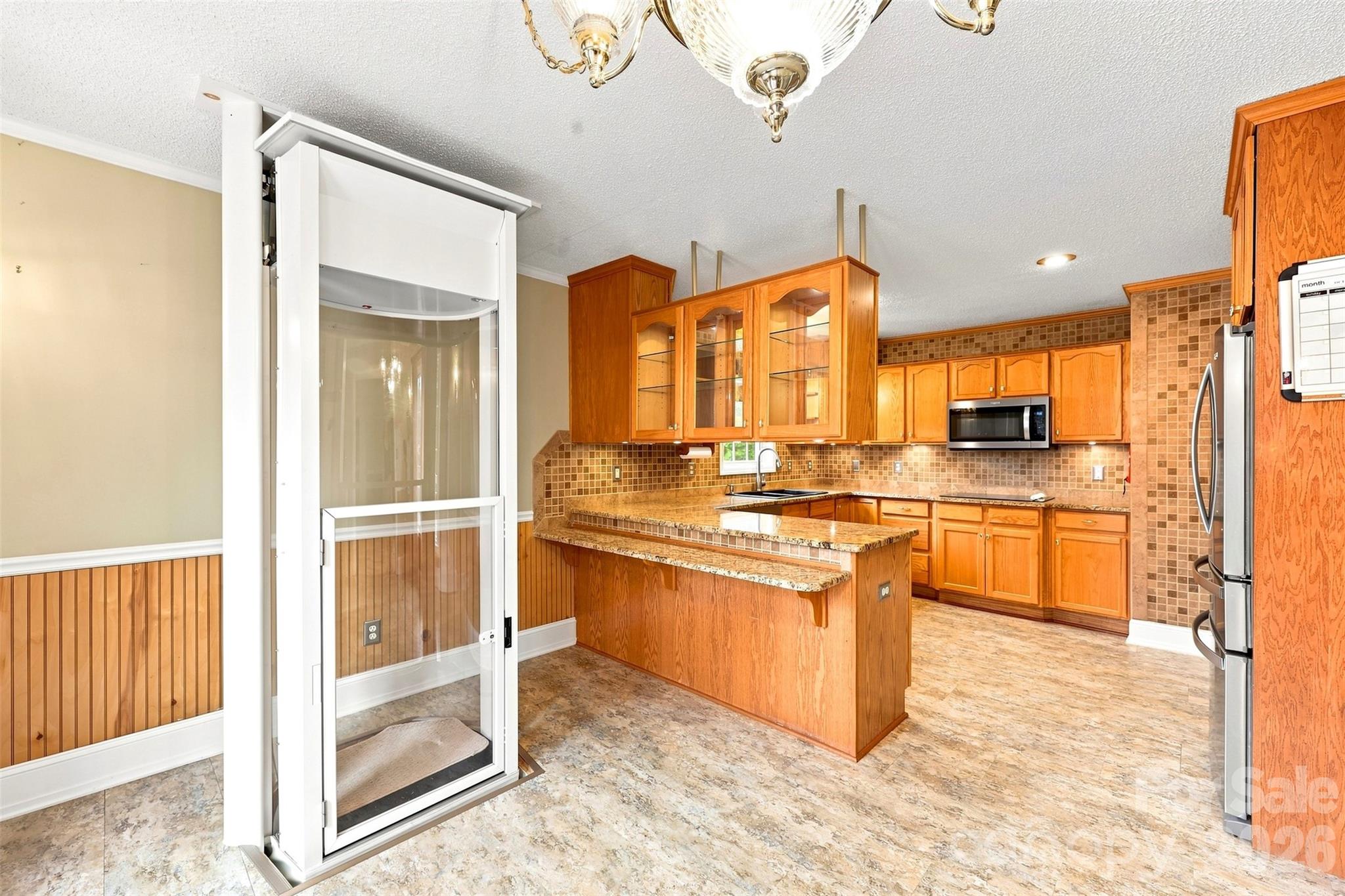 Lift to access the basement. - 199 Bethlehem Manufacturing Lane, Hickory