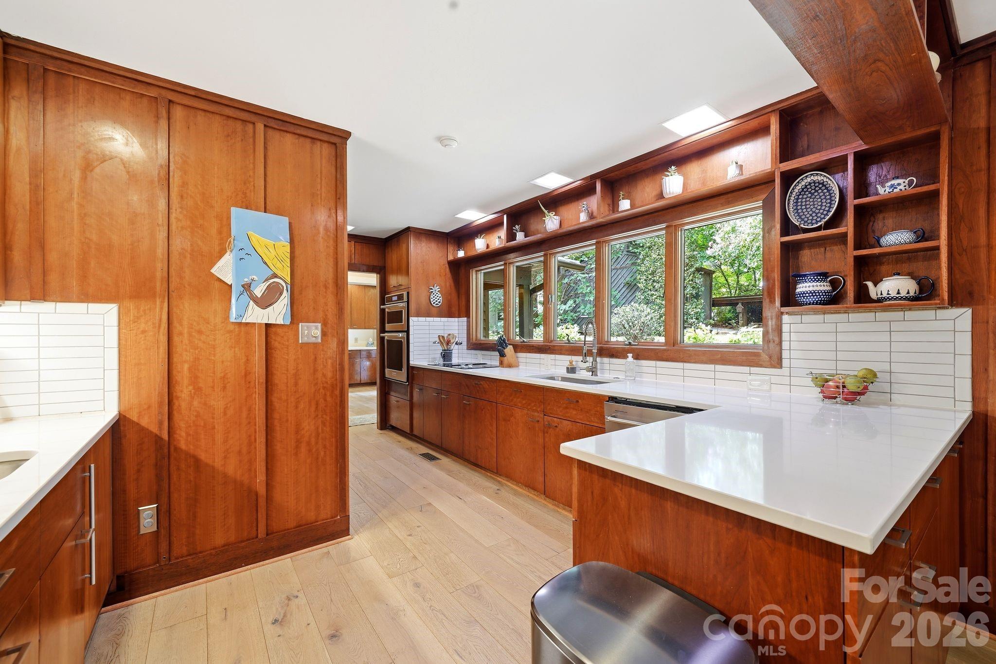Spacious Kitchen with Casement Windows overlooking tranquil backyard - 515 Dogwood Lane, Belmont