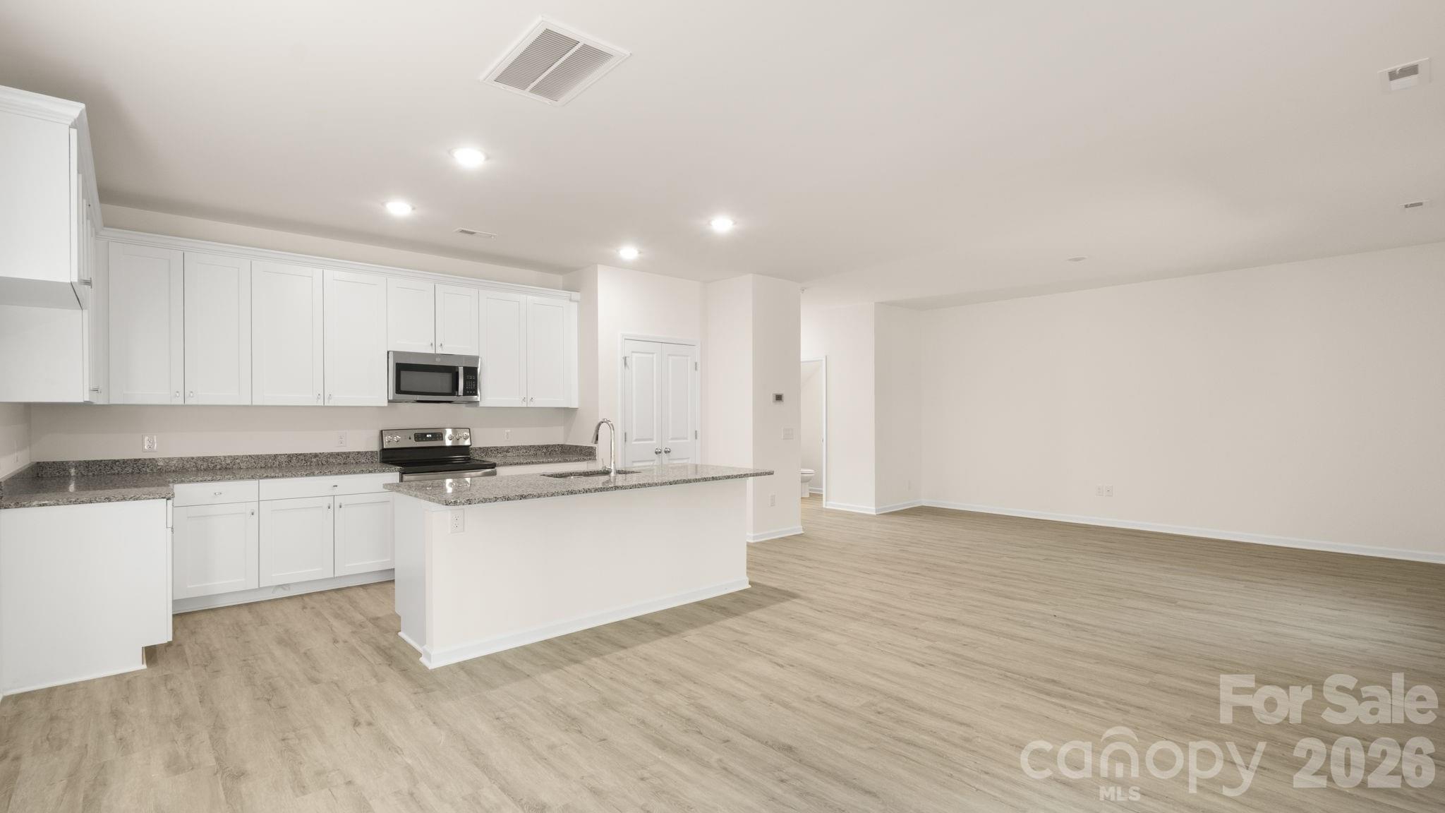 Breakfast area to Kitchen - 4022 Rolling Creek Road, Vale