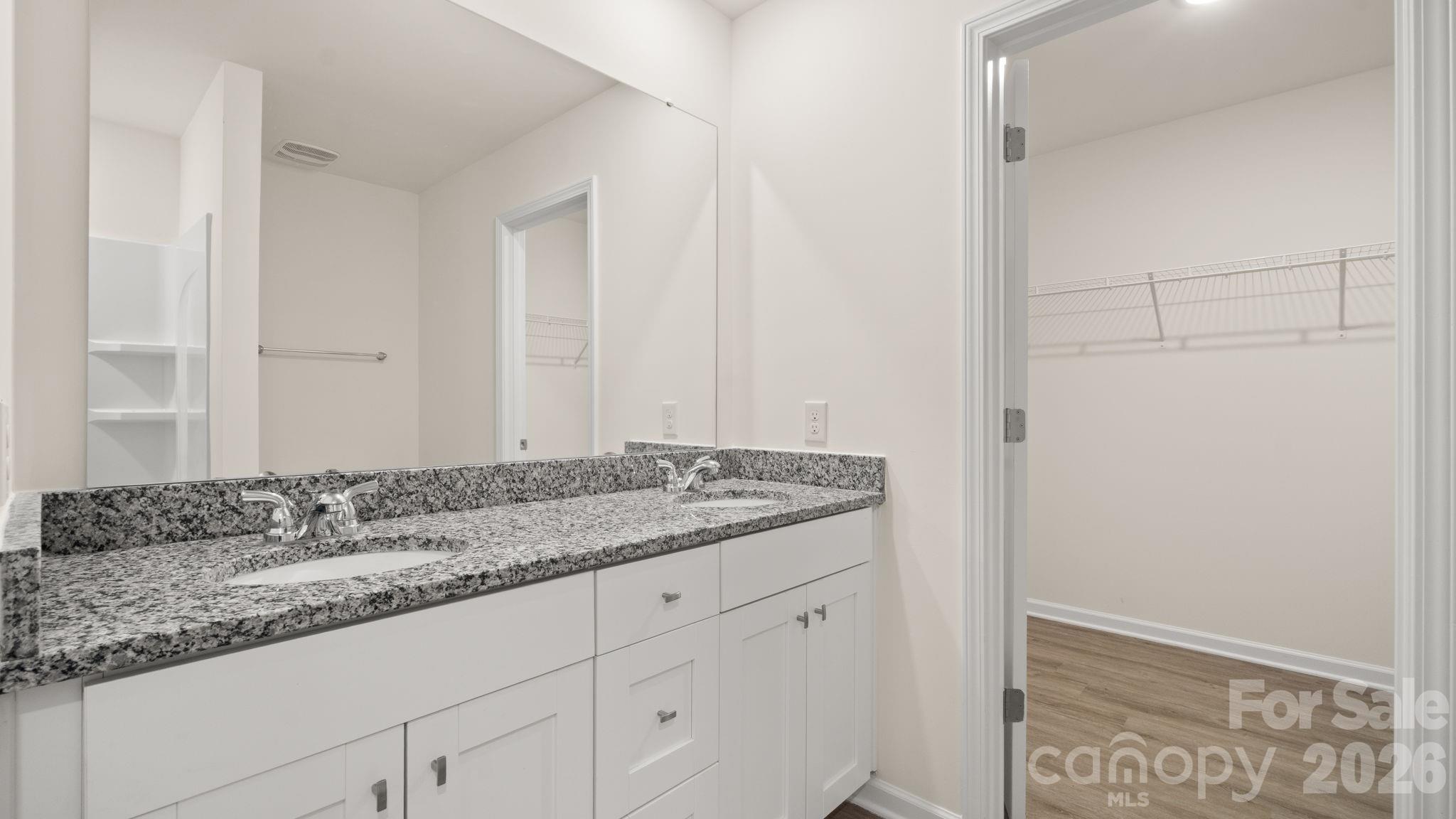 Primary Bathroom opening to Walk-In Closet - 4022 Rolling Creek Road, Vale