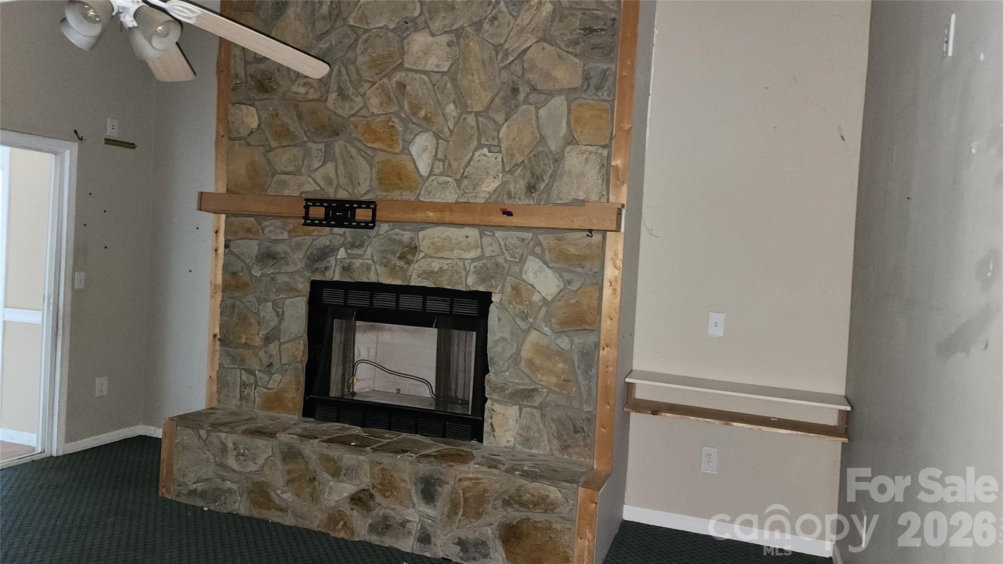 Fireplace in Den on main level. - 2020 Ada Williams Lane, Lenoir
