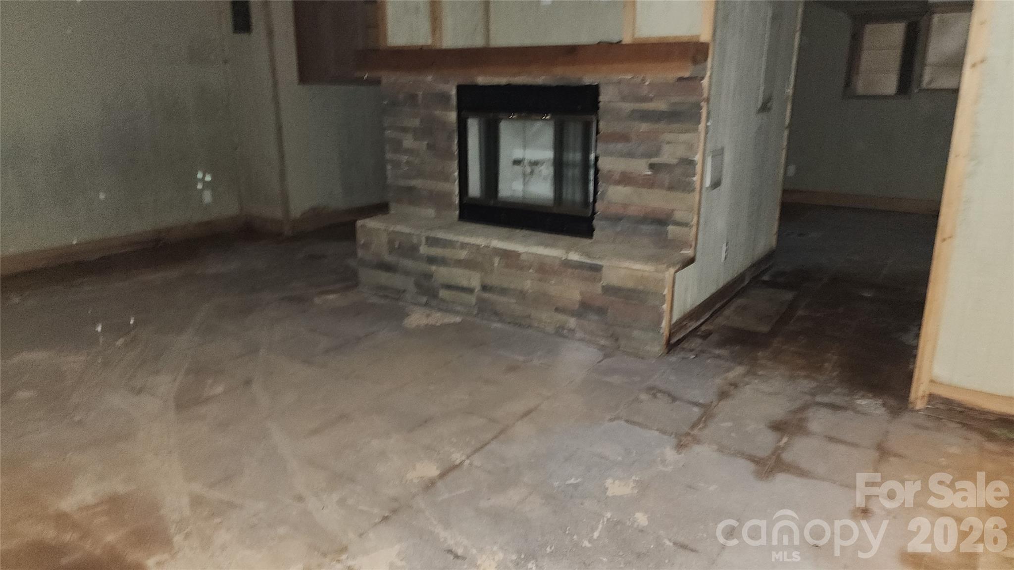 Fireplace in basement - 2020 Ada Williams Lane, Lenoir