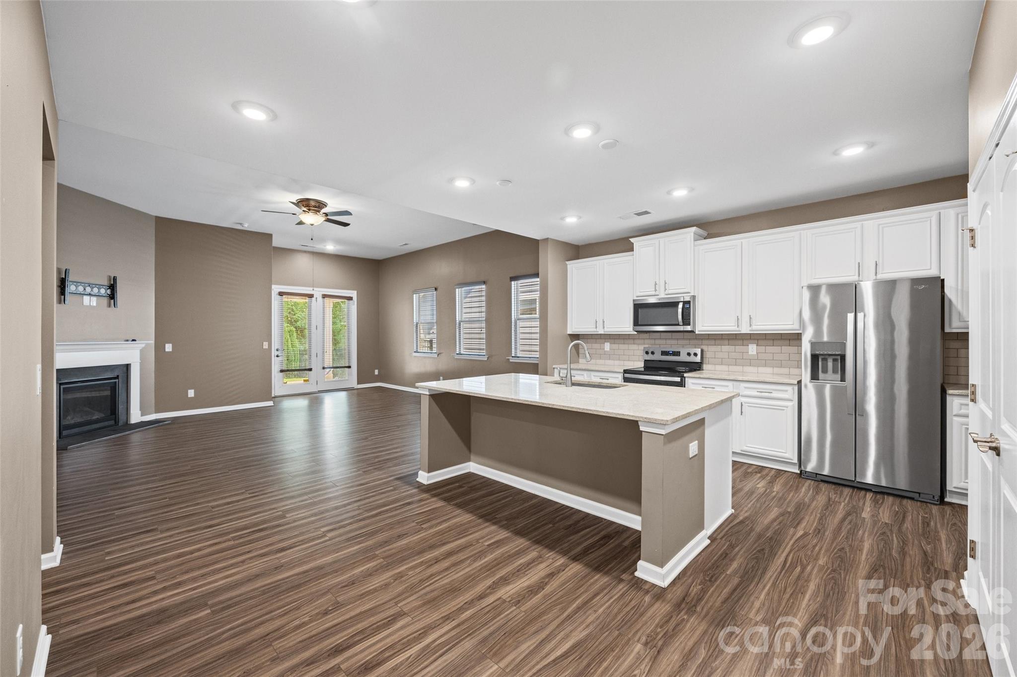 Open-concept kitchen and living space designed for easy everyday living, family gatherings, and effortless entertaining. - 596 Rustlewood Way, Rock Hill