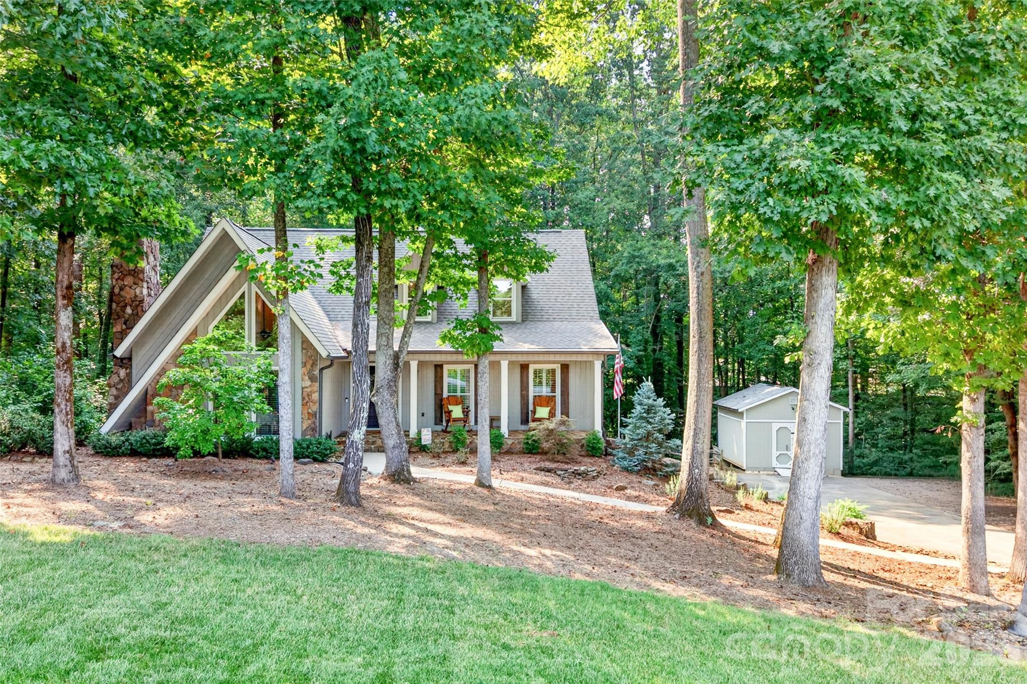Perfectly nestled on a half acre tree-lined homesite in an established area - 1345 Gaston Day School Road, Gastonia