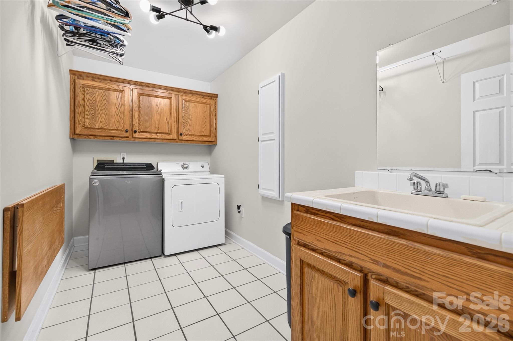 Huge Laundry on Main with Utility Sink, tuck-away folding bar and hanging area - 1345 Gaston Day School Road, Gastonia