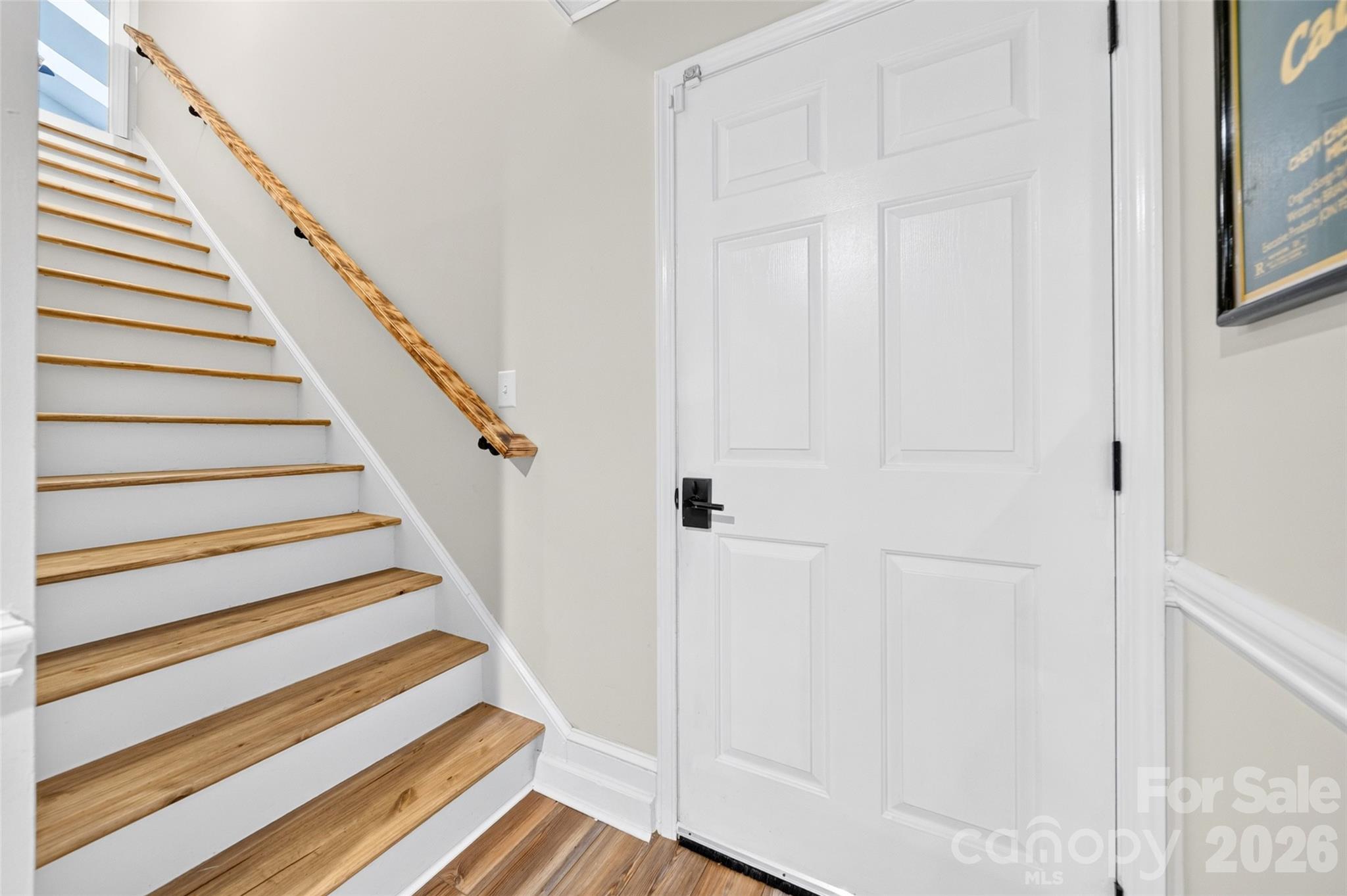 Hardwood stairs leading to basement and garage - 1345 Gaston Day School Road, Gastonia
