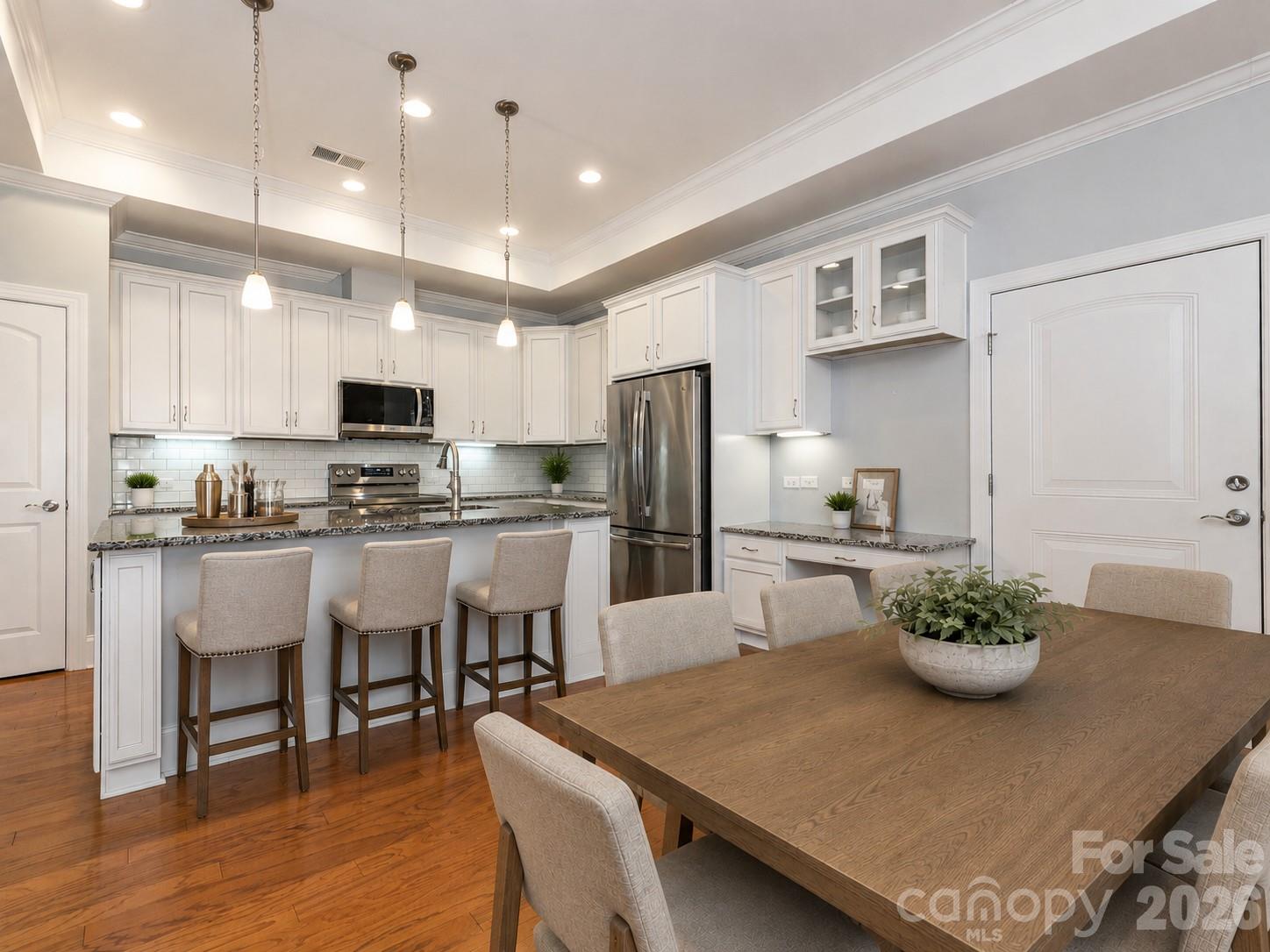 Virtually staged kitchen and dining area - 4534 Ideal Way, Harrisburg