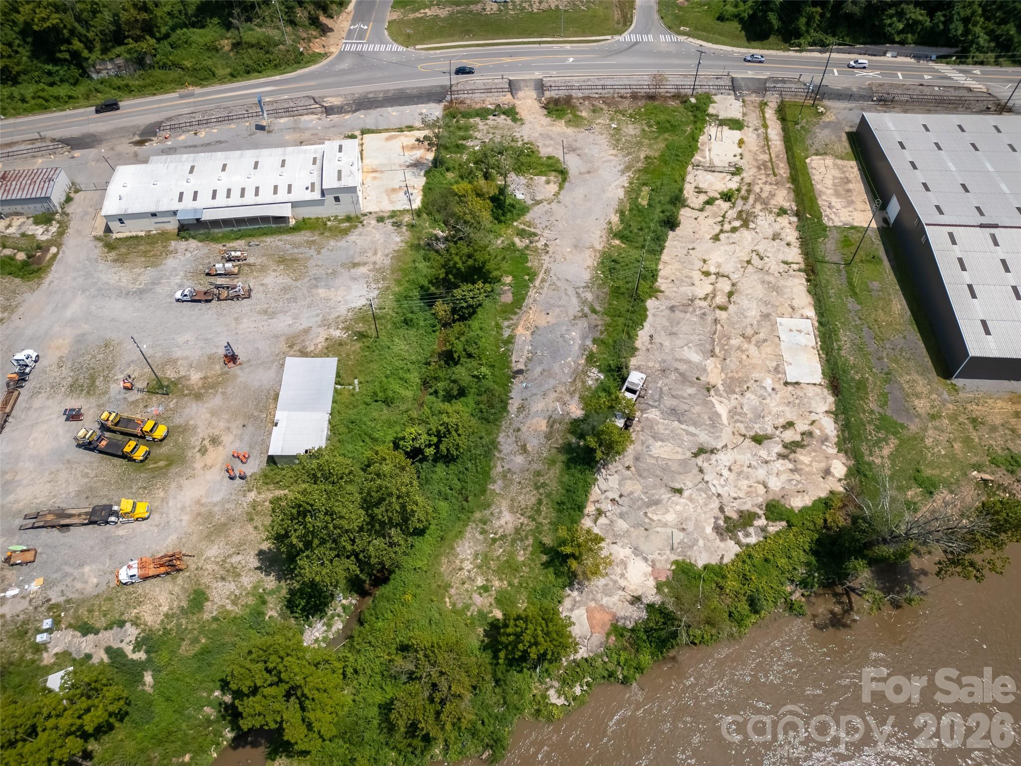 From the river side of property looking back towards I-26 / Hwy 19. - 458 Riverside Drive, Asheville