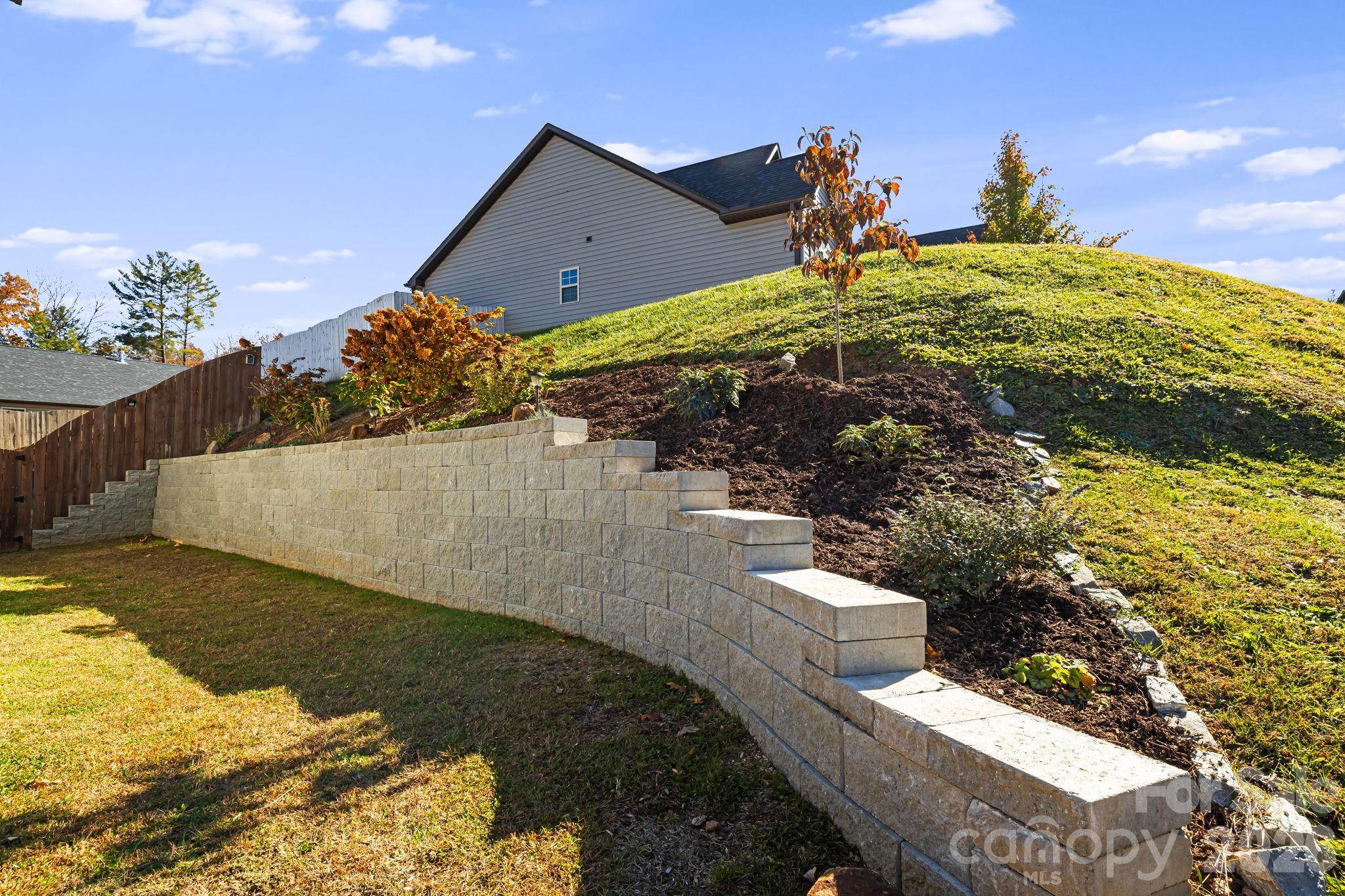 Brand new $15K Stone Terrace added in 2024 - Easy step access for gardening. New Dogwood Tree added - The NC State Tree!! - 504 Rosebud Orchid Way, Weaverville