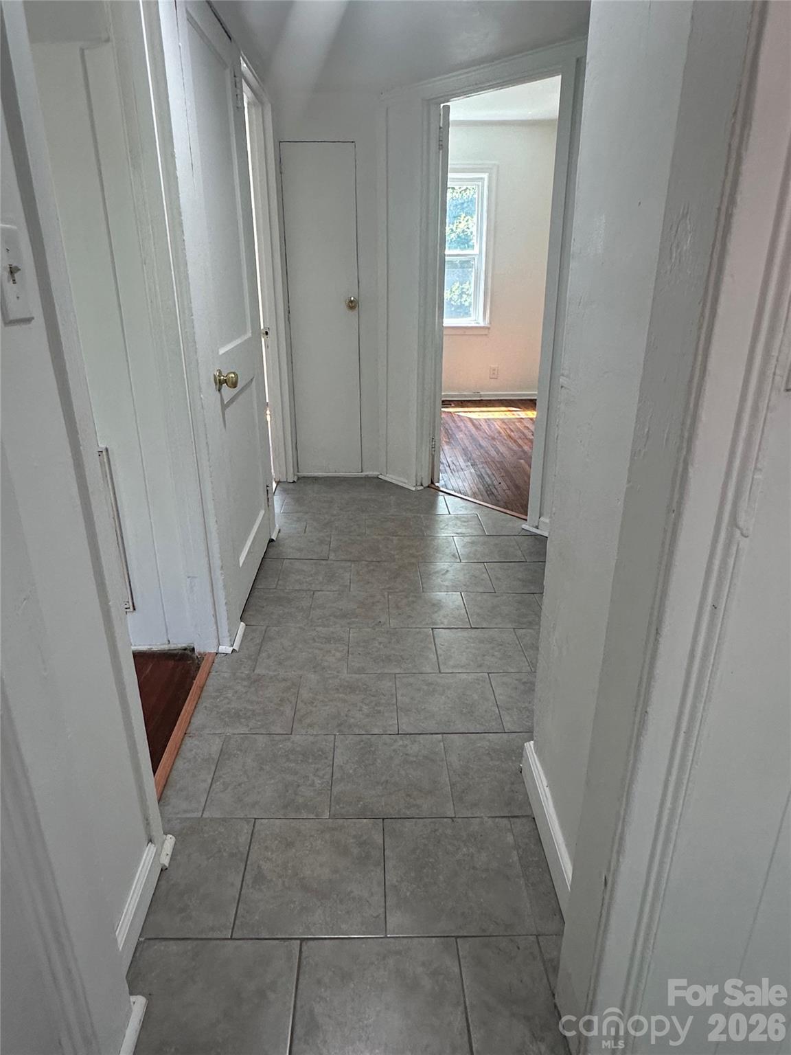 Hallway looking from kitchen to bedrooms. Living room on the left and main bath on the right - 1005 William Drive, Winston Salem
