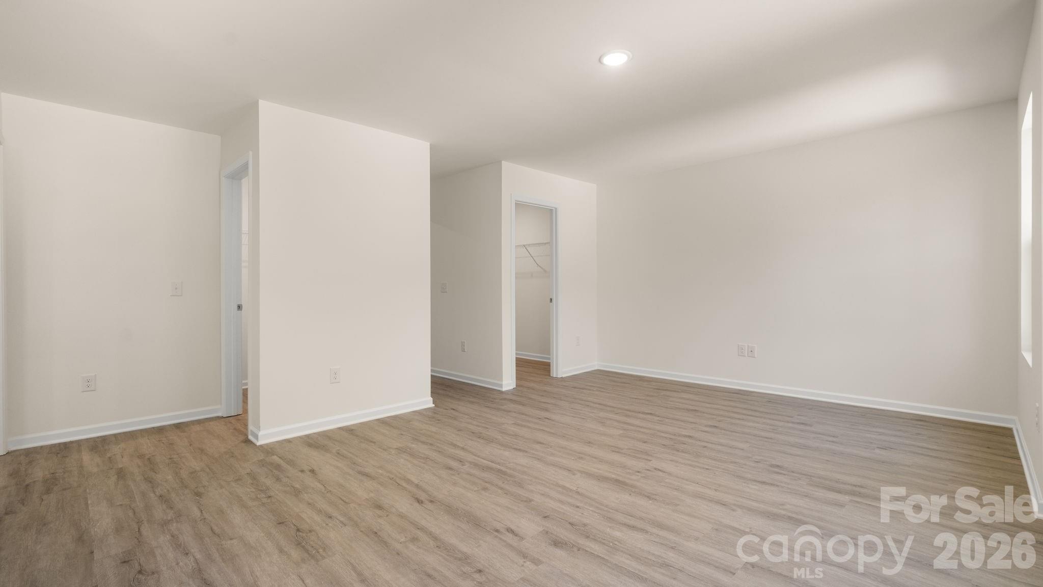 Primary Bedroom with dual walk-in closets. - 4029 Rolling Creek Drive, Vale