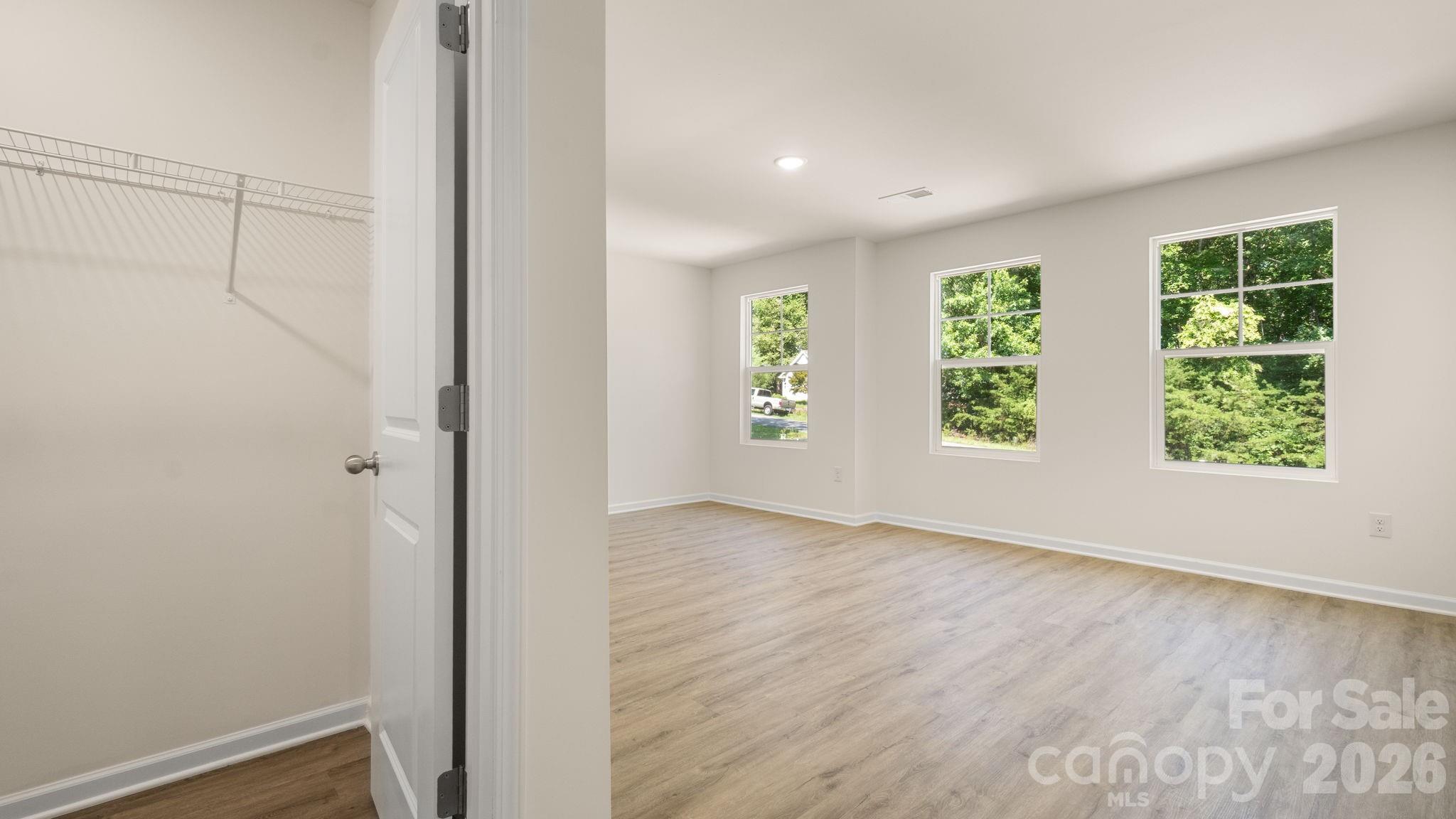 Primary Bedroom with dual walk-in closets. - 4029 Rolling Creek Drive, Vale
