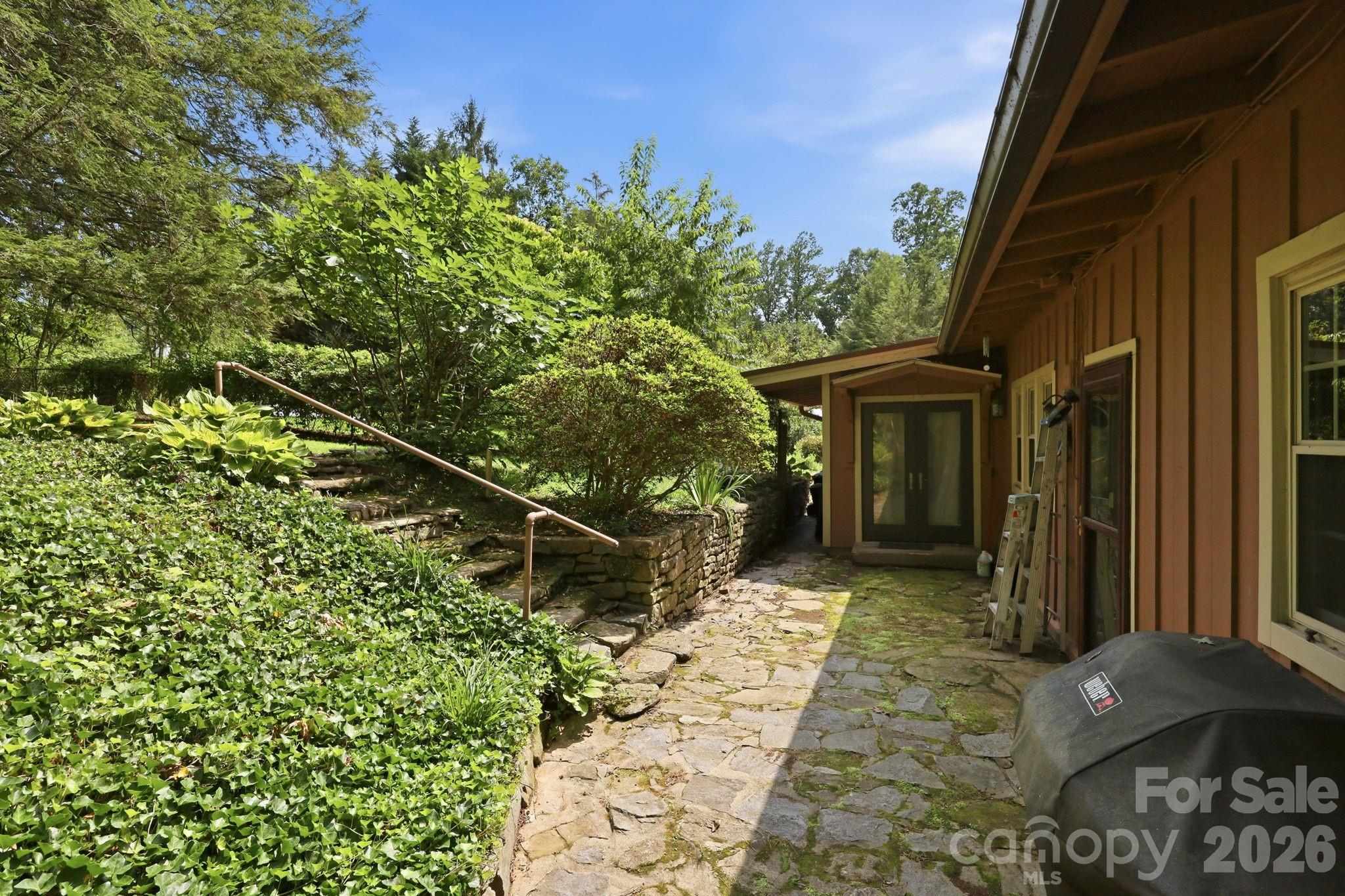 Stone patio area on back of property - 1925 Laurel Park Highway, Hendersonville
