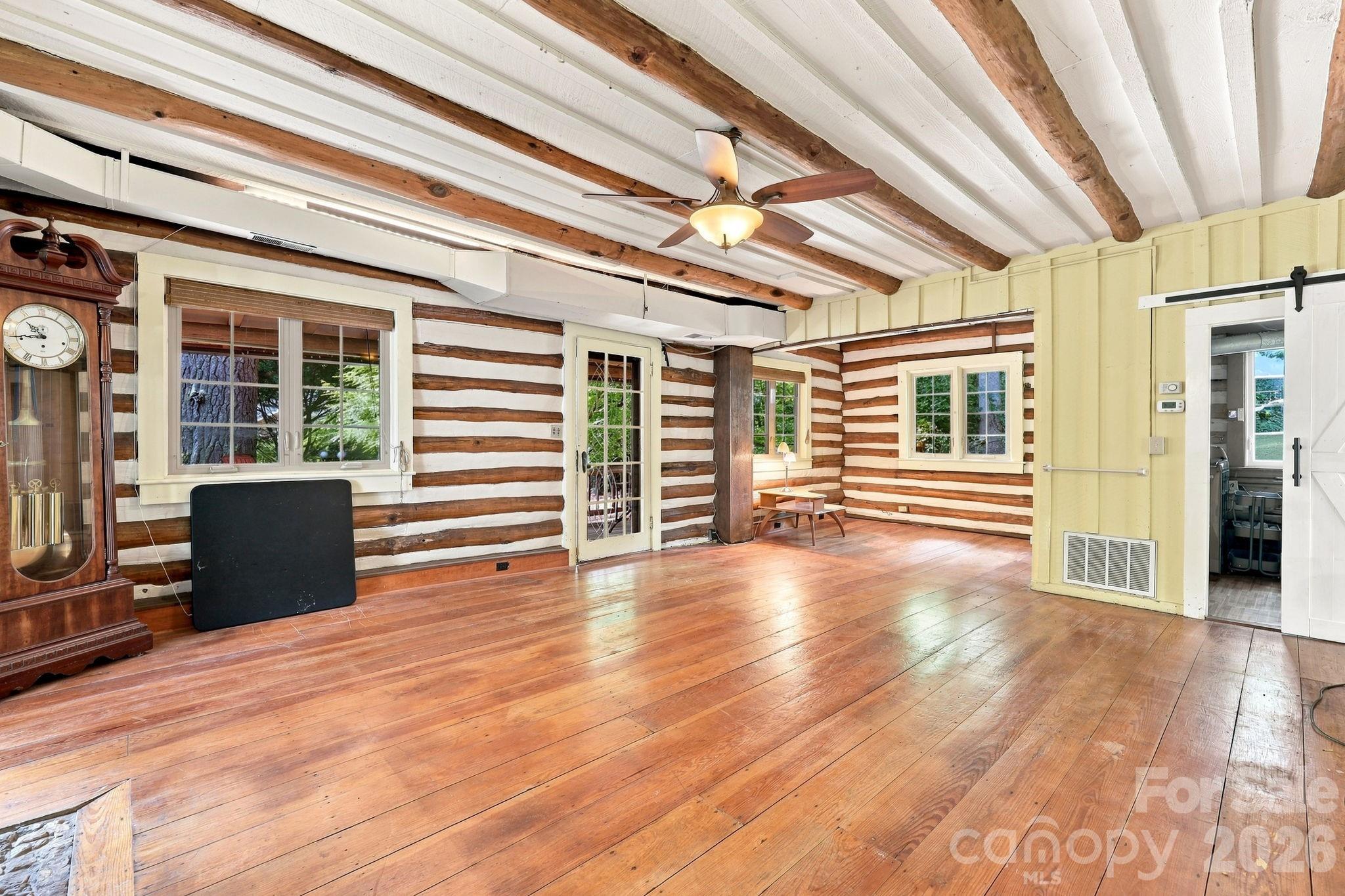 Living room looking at door to front porch and dining area - 1925 Laurel Park Highway, Hendersonville