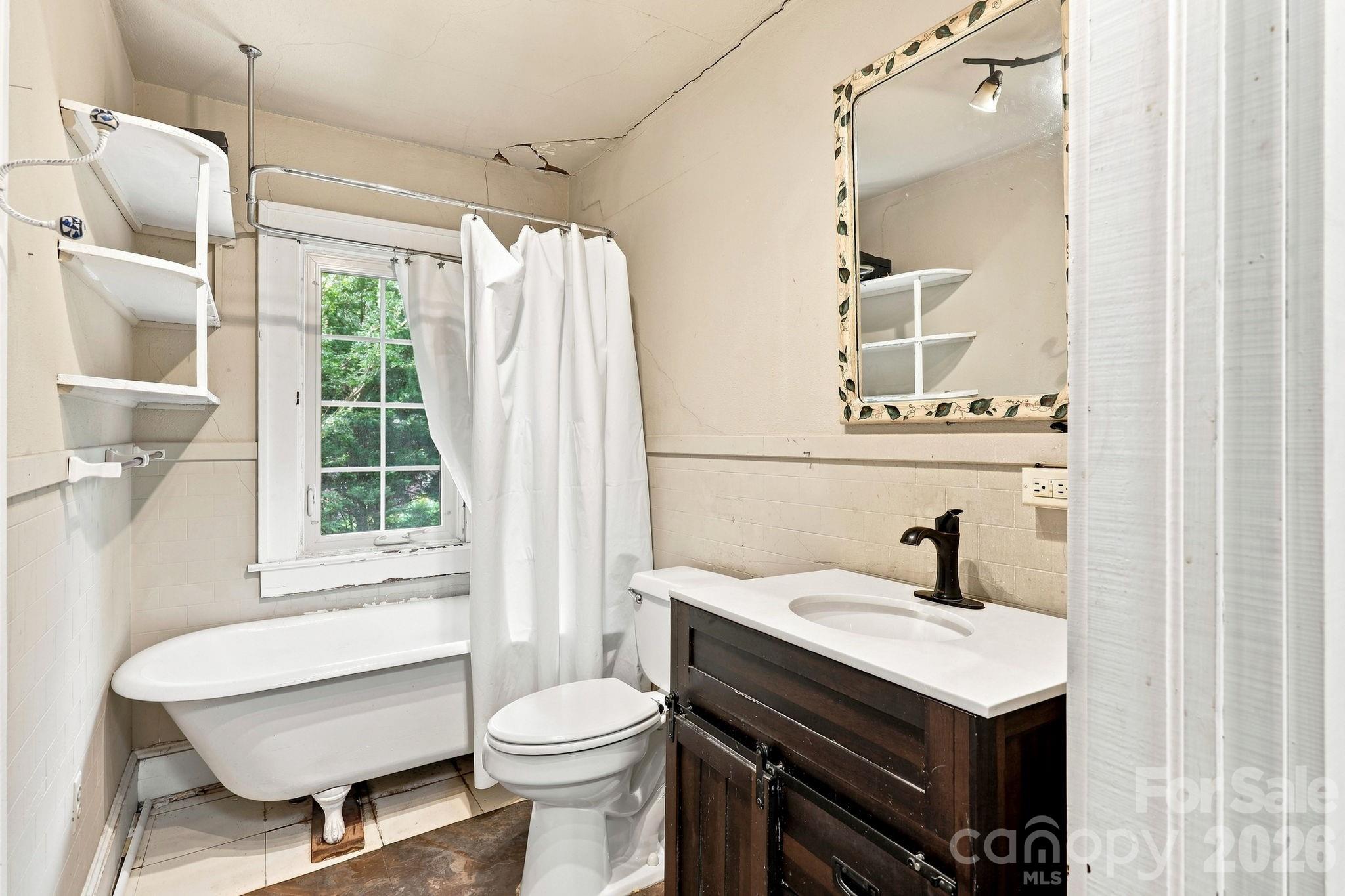 Upstairs bathroom (Notice settling on ceiling and wall) - 1925 Laurel Park Highway, Hendersonville