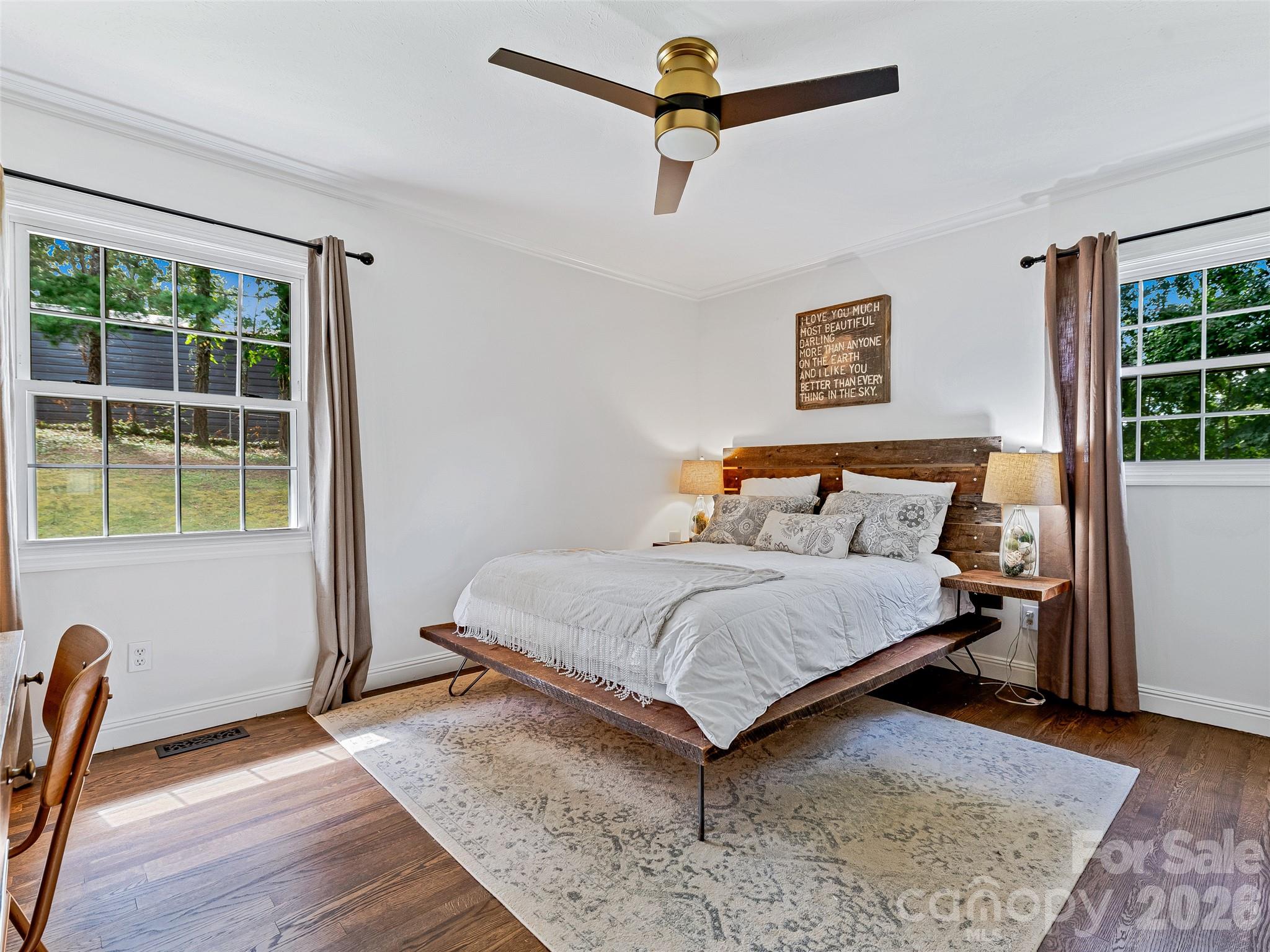 Primary bedroom with wood flooring and ample outside light - 7 Southwicke Drive, Arden