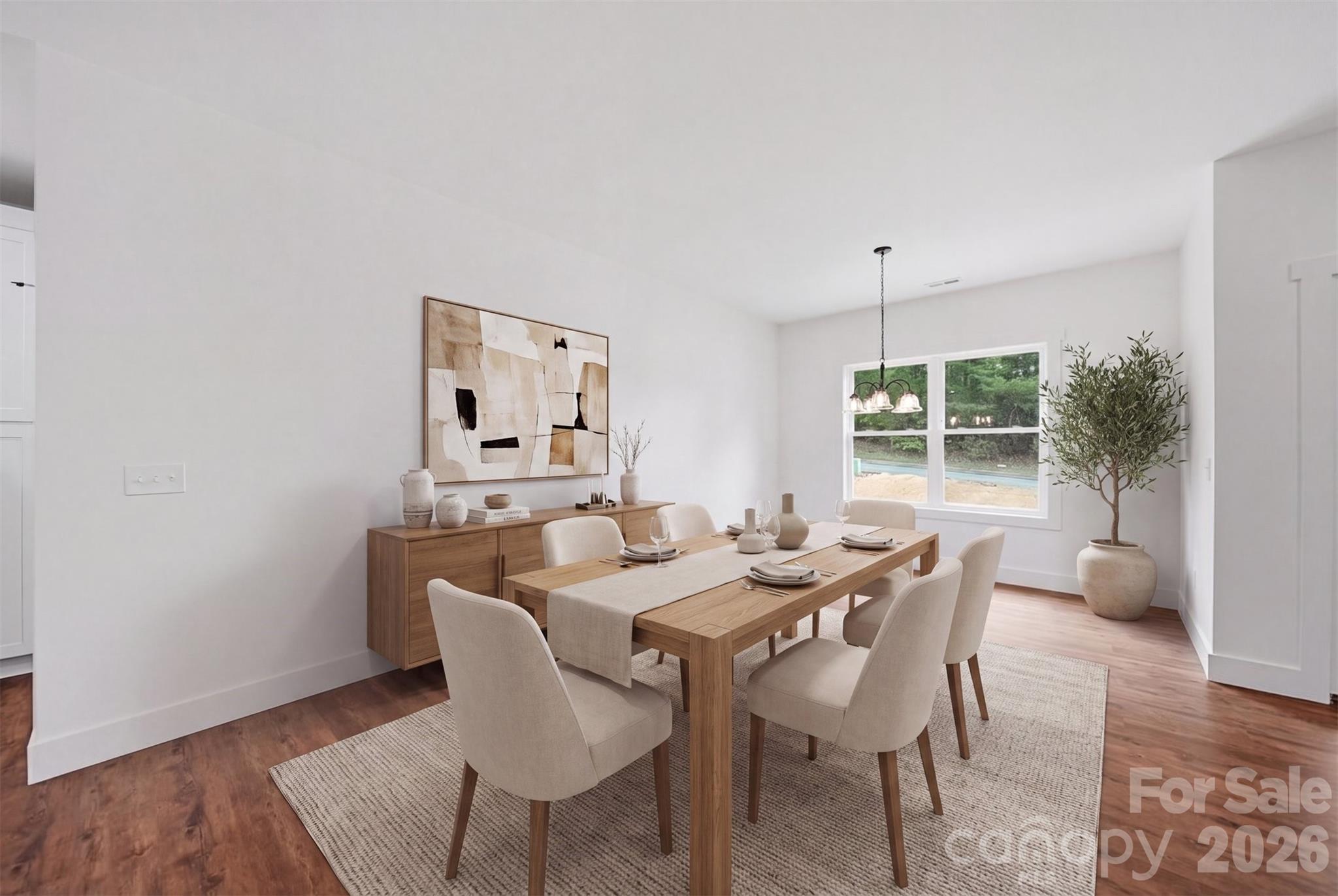 Dining Area is virtually staged. It overlooks the backyard, walking trail and wooded area. - 414 Scarlett Oak Court NE, Lenoir