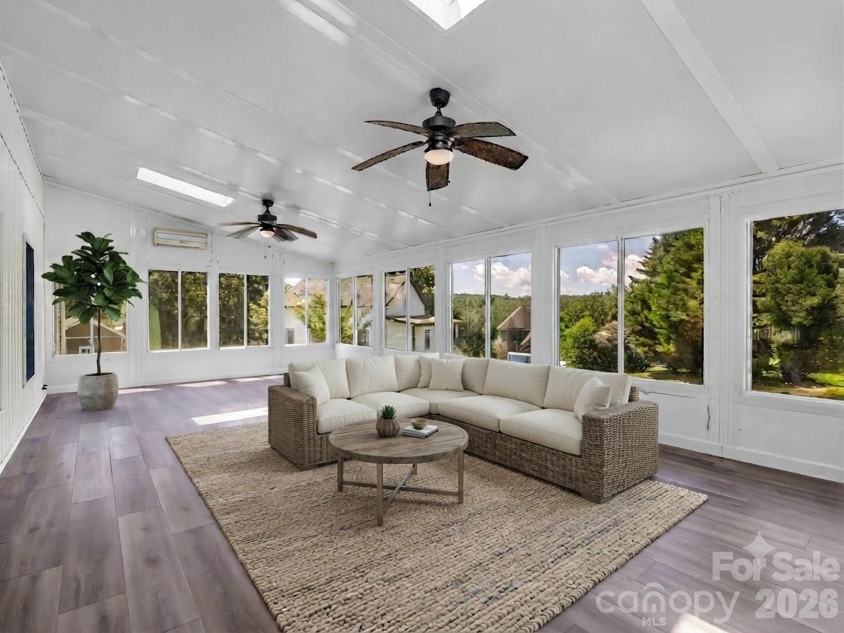 29 x 15 Sunroom with new LVP + mini-split. Virtually Staged - 355 Hidden Meadow Drive, Hendersonville