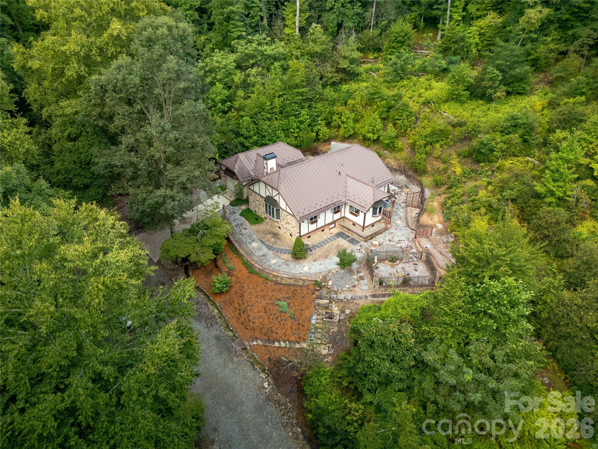 House and Outdoor Setting from the air on the right side. Almost 11 acres of beautiful trees, foliage, and privacy surrounds the house! - 275 Hubbard Hollow Road, Rosman