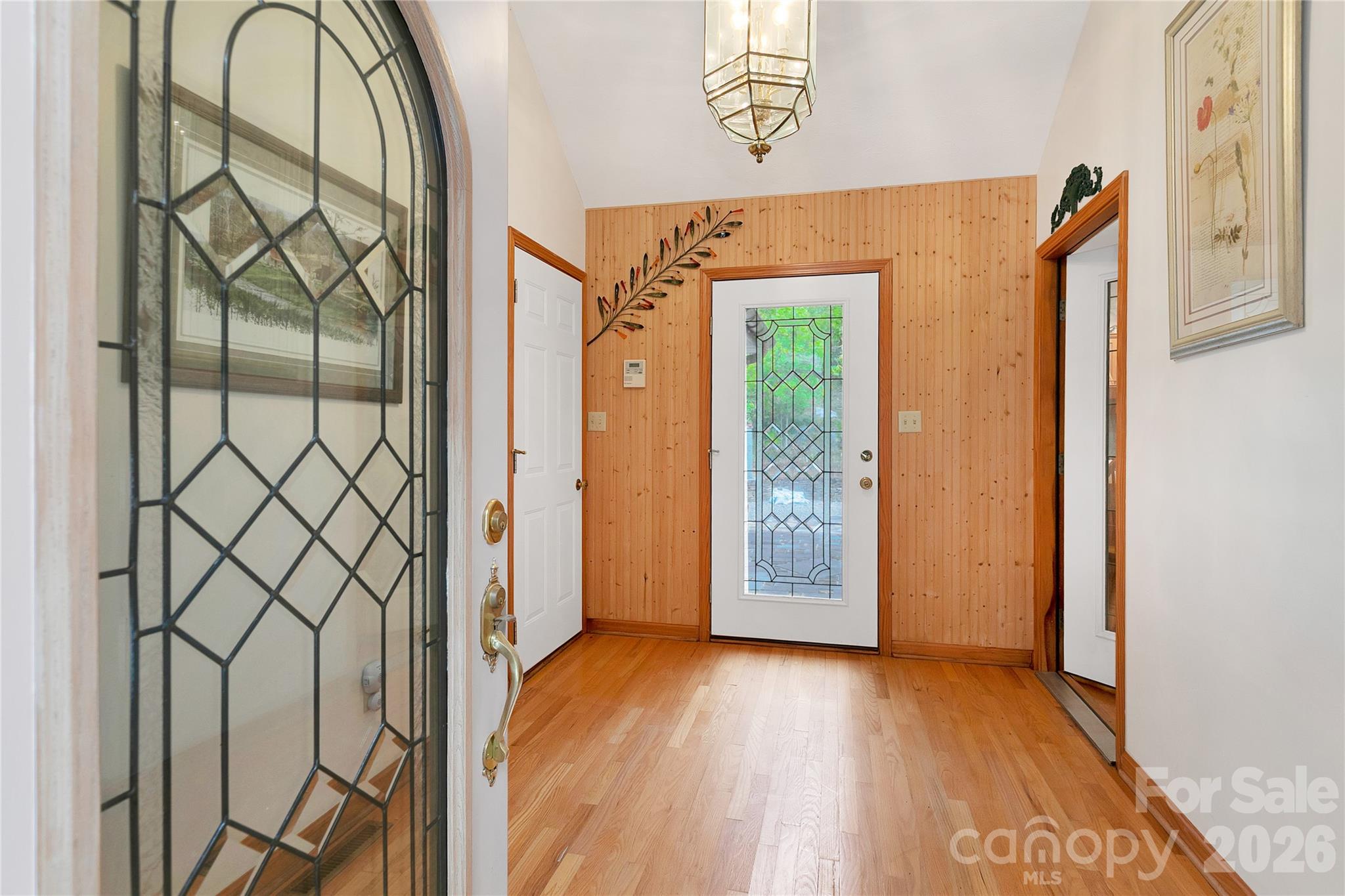 Entering the stained-glass front door you are in the large entry way / foyer with its stained-glass back door! - 275 Hubbard Hollow Road, Rosman