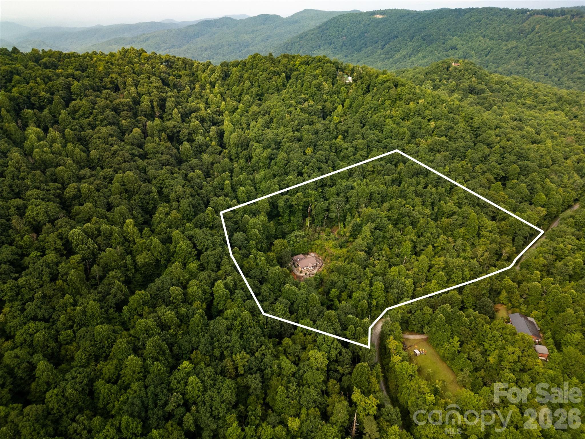 An oasis of privacy on this almost eleven (11) acre parcel. As seen here, "Ain't many neighbors in ear shot".! Plenty of room to build another house on five of these acres if you wish. - 275 Hubbard Hollow Road, Rosman