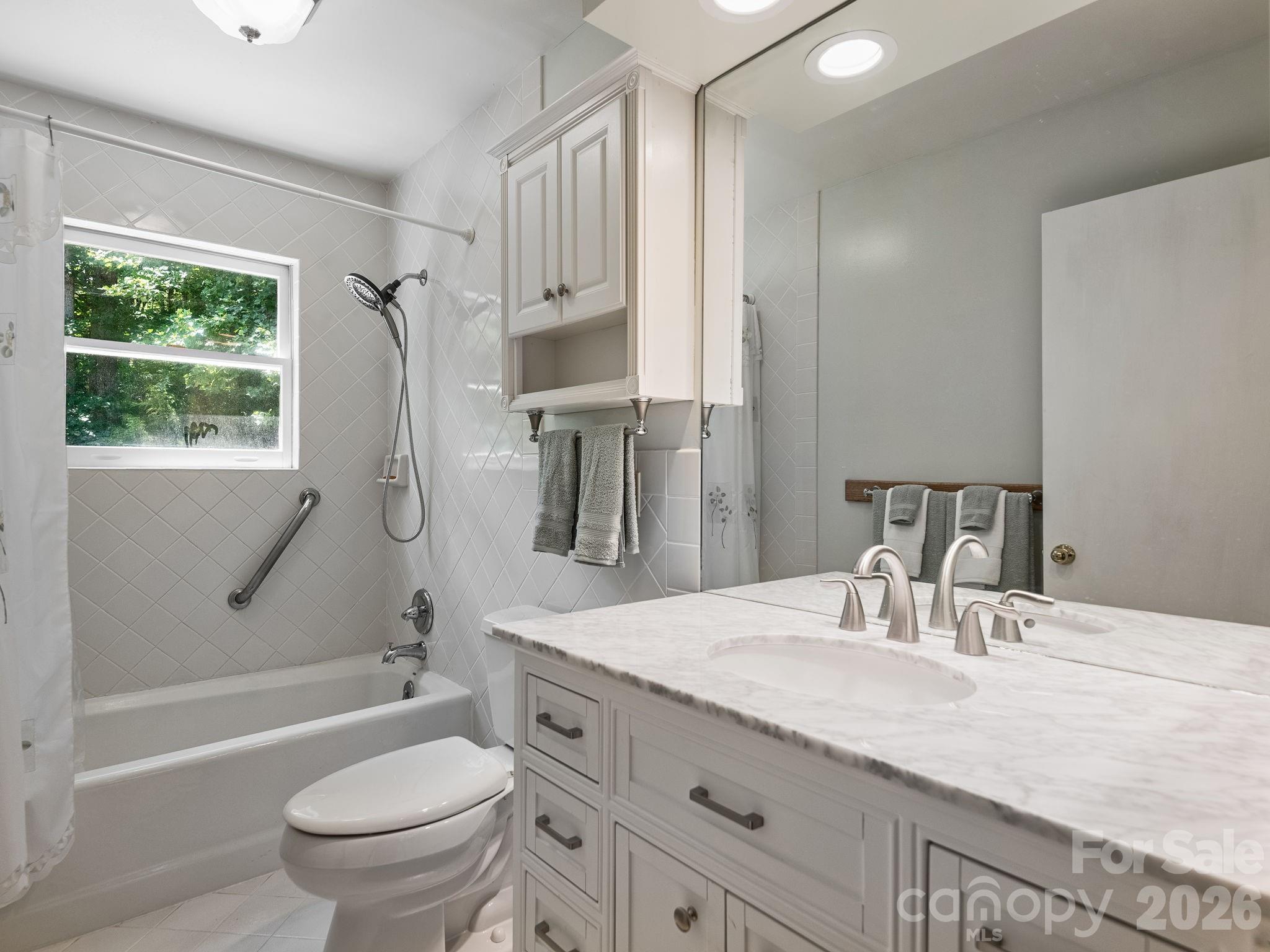 A stylish updated vanity and full bathroom on main level - 1572 Brushy Fork Road, Sylva
