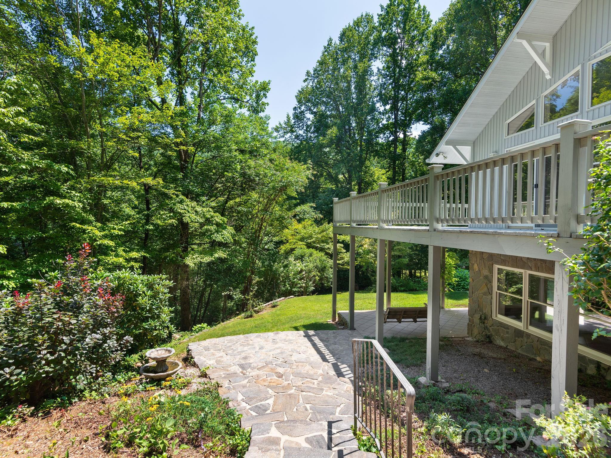 Private patio awaits, offering the perfect place to relax and enjoy the peaceful surroundings. - 1572 Brushy Fork Road, Sylva