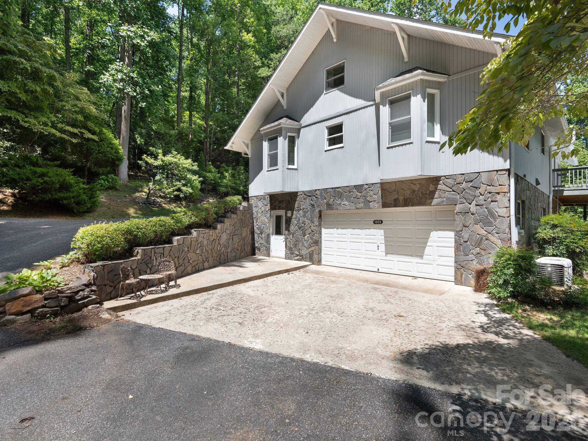 Two-car garage with abundant parking. - 1572 Brushy Fork Road, Sylva