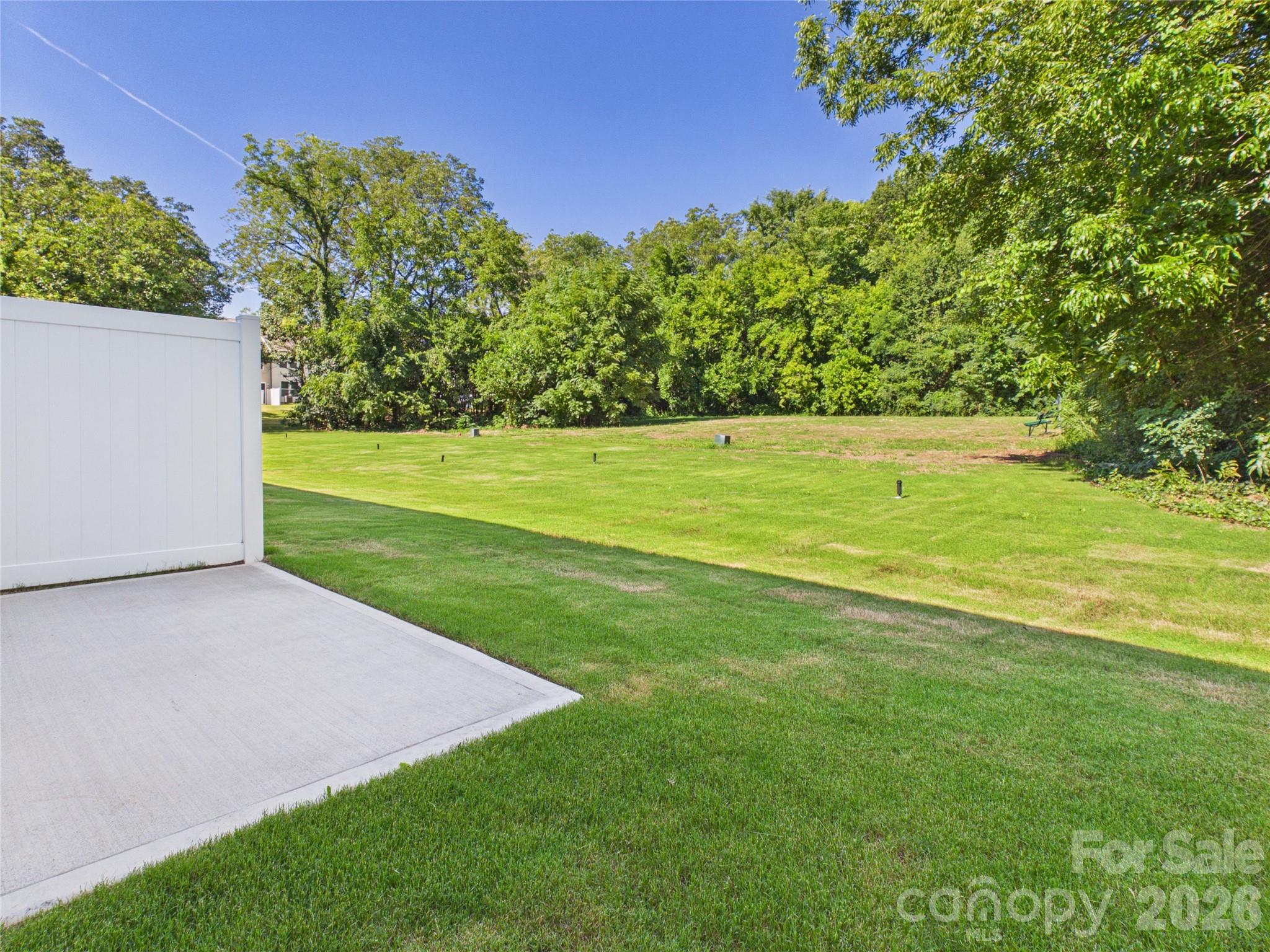 12' x 12' Patio with large yard space and privacy fence between homes. - 105 Dilling Street N, Kings Mountain